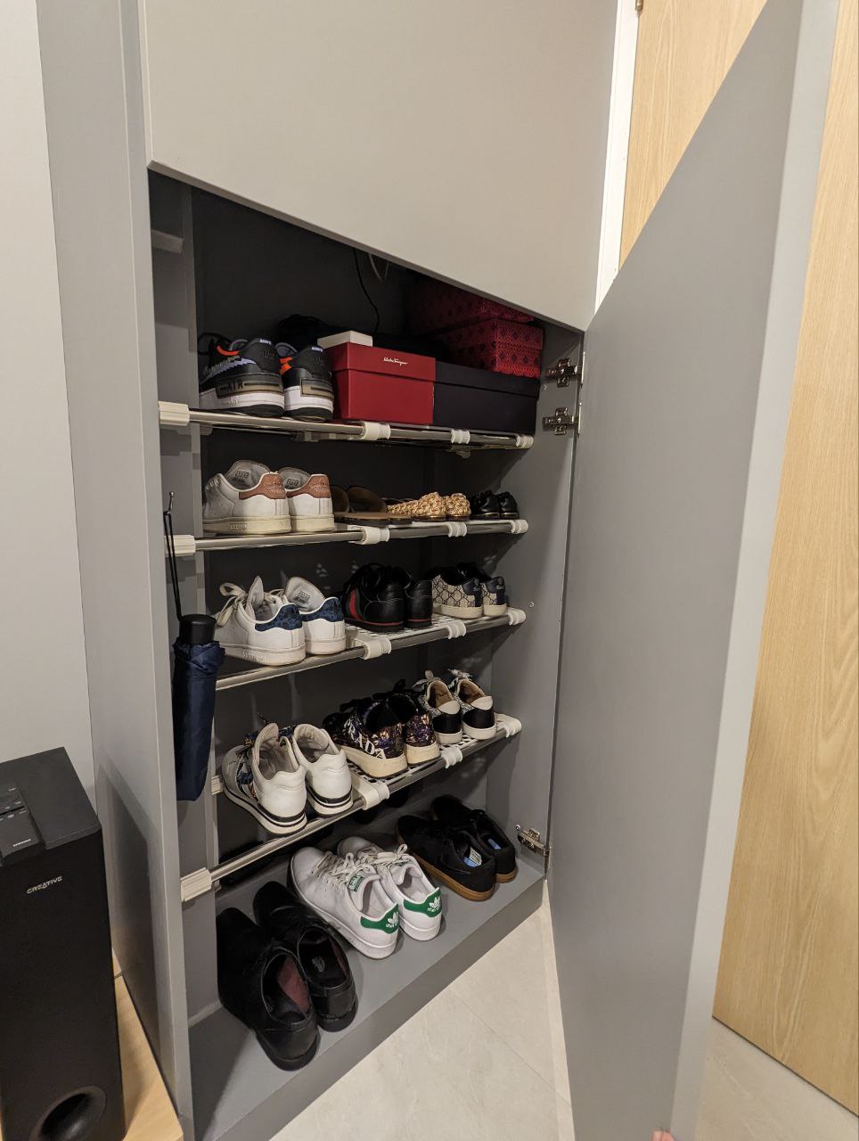 Entryway to our hearts - Gray shoe cabinet, neatly organized shoes, multiple shoe shelves, black and white sneakers