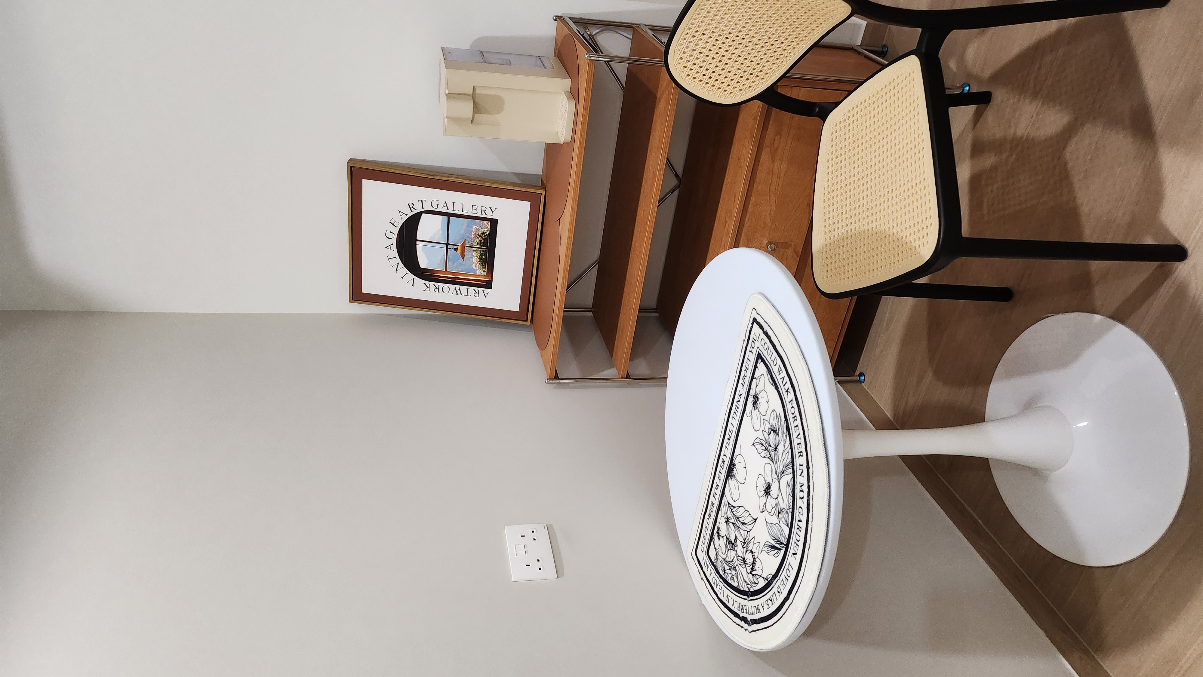 Minimalist Monopoly.home - Garden-themed decor, minimalist interior, modern furniture, wooden desk, woven chair, white round