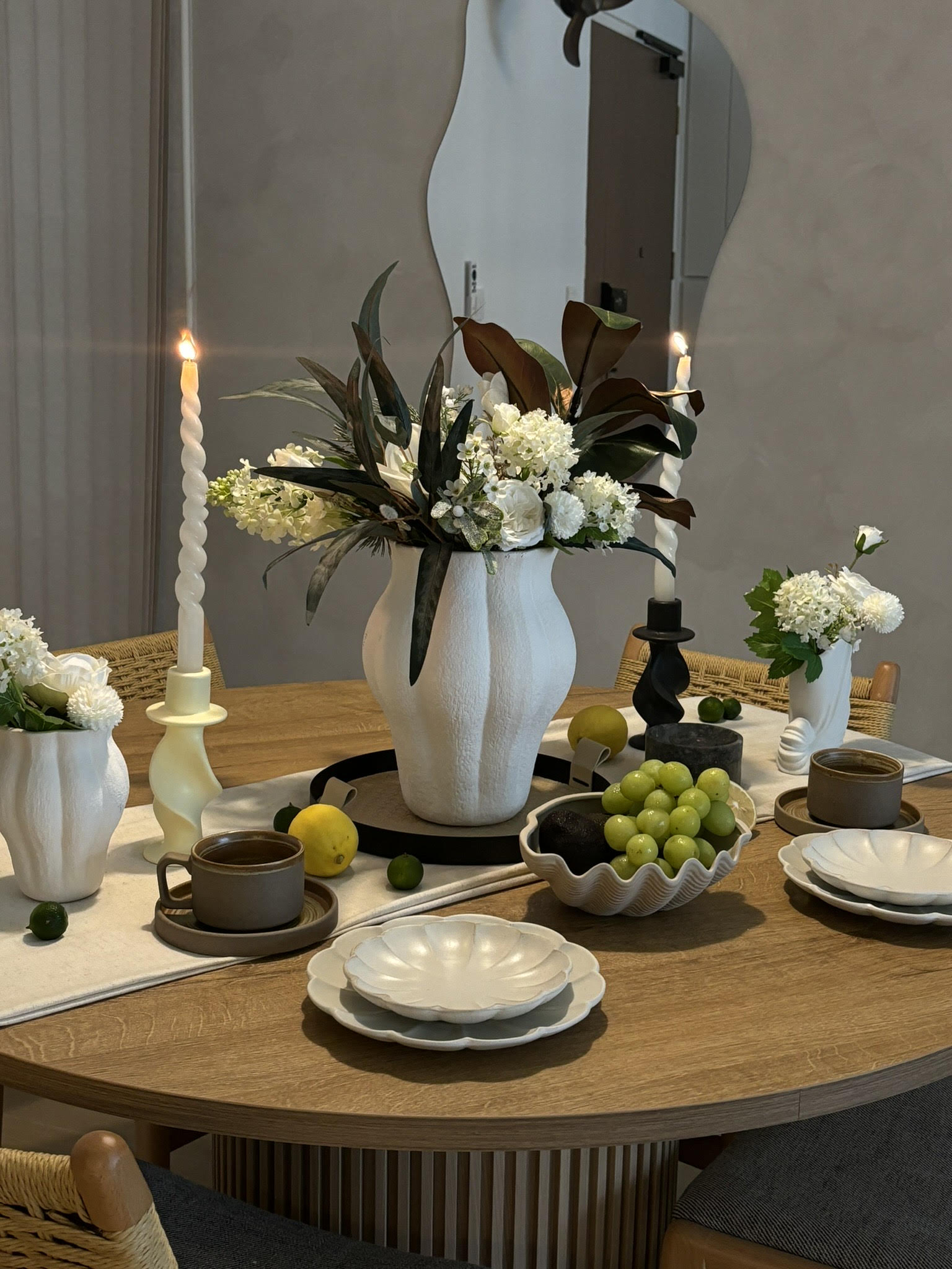 Our dining space: an area reserved for hosting meals - vase, table setting, candles, flowers, greenery, white flowers, black