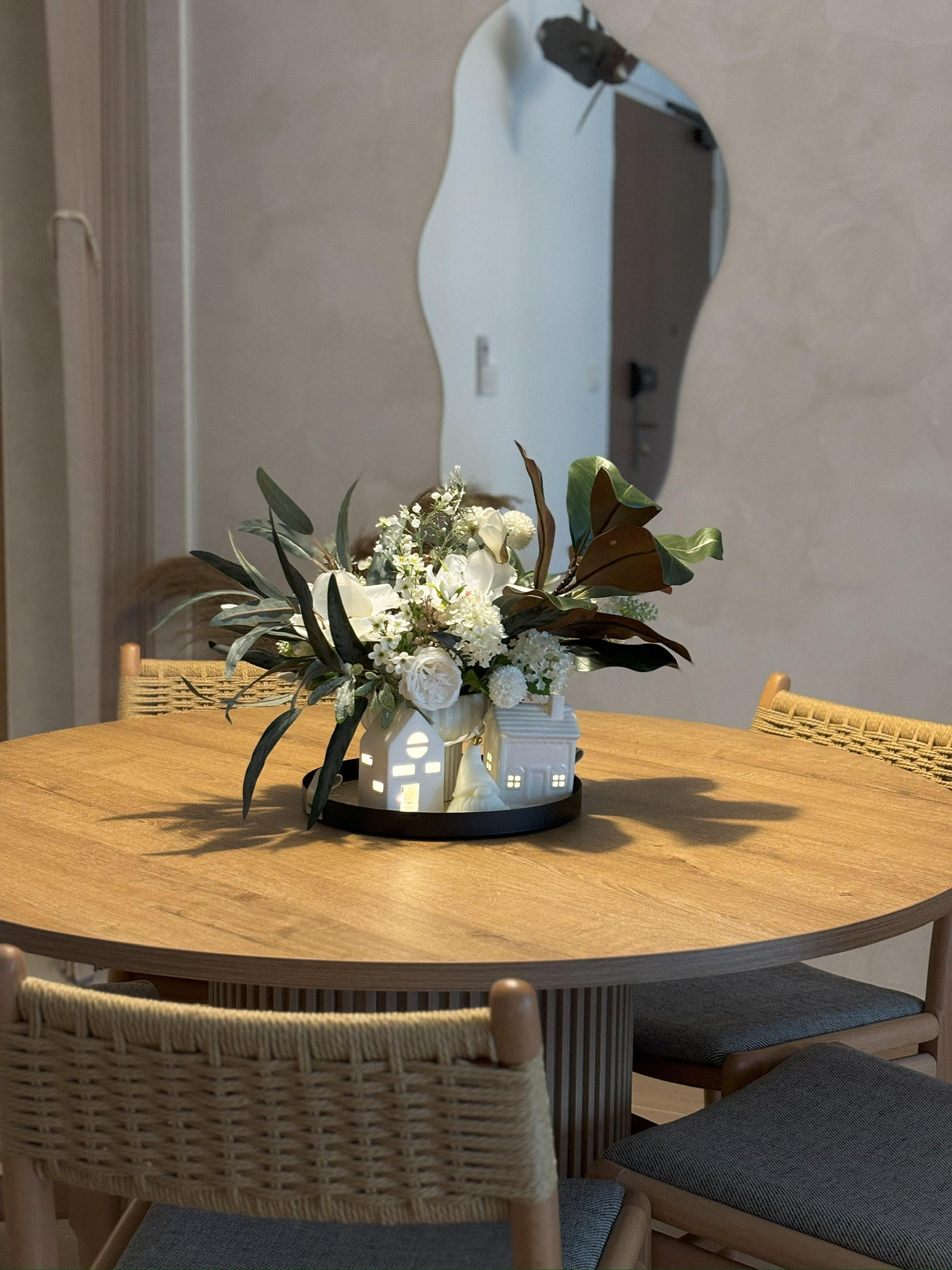 Our dining space: an area reserved for hosting meals - Modern dining room, round wooden table, elegant floral arrangement