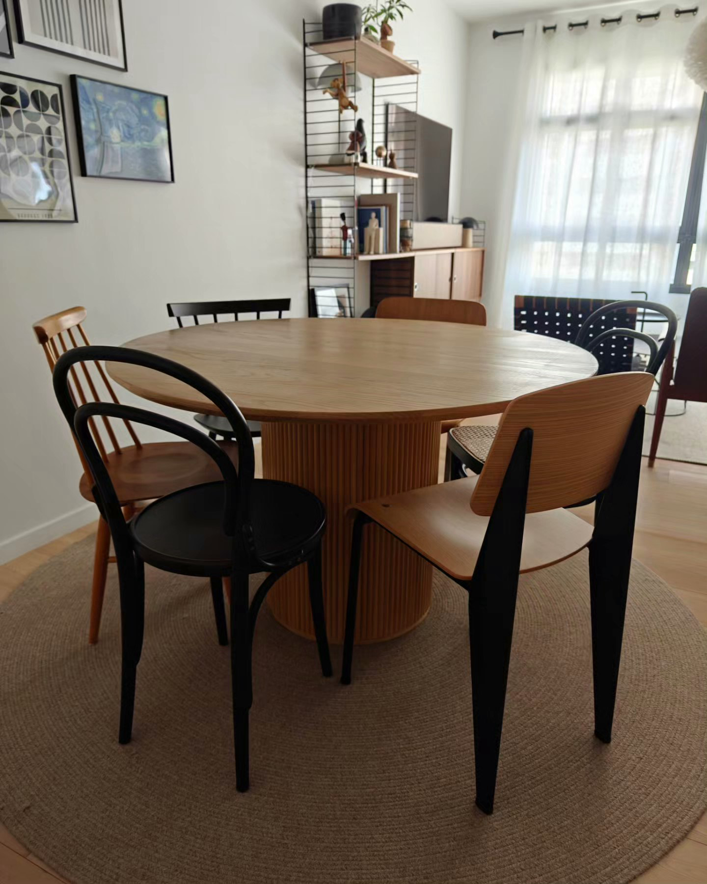 Eat Drink Man Woman - Modern dining room with wooden table and chairs, minimalist decor, round table with black and wooden