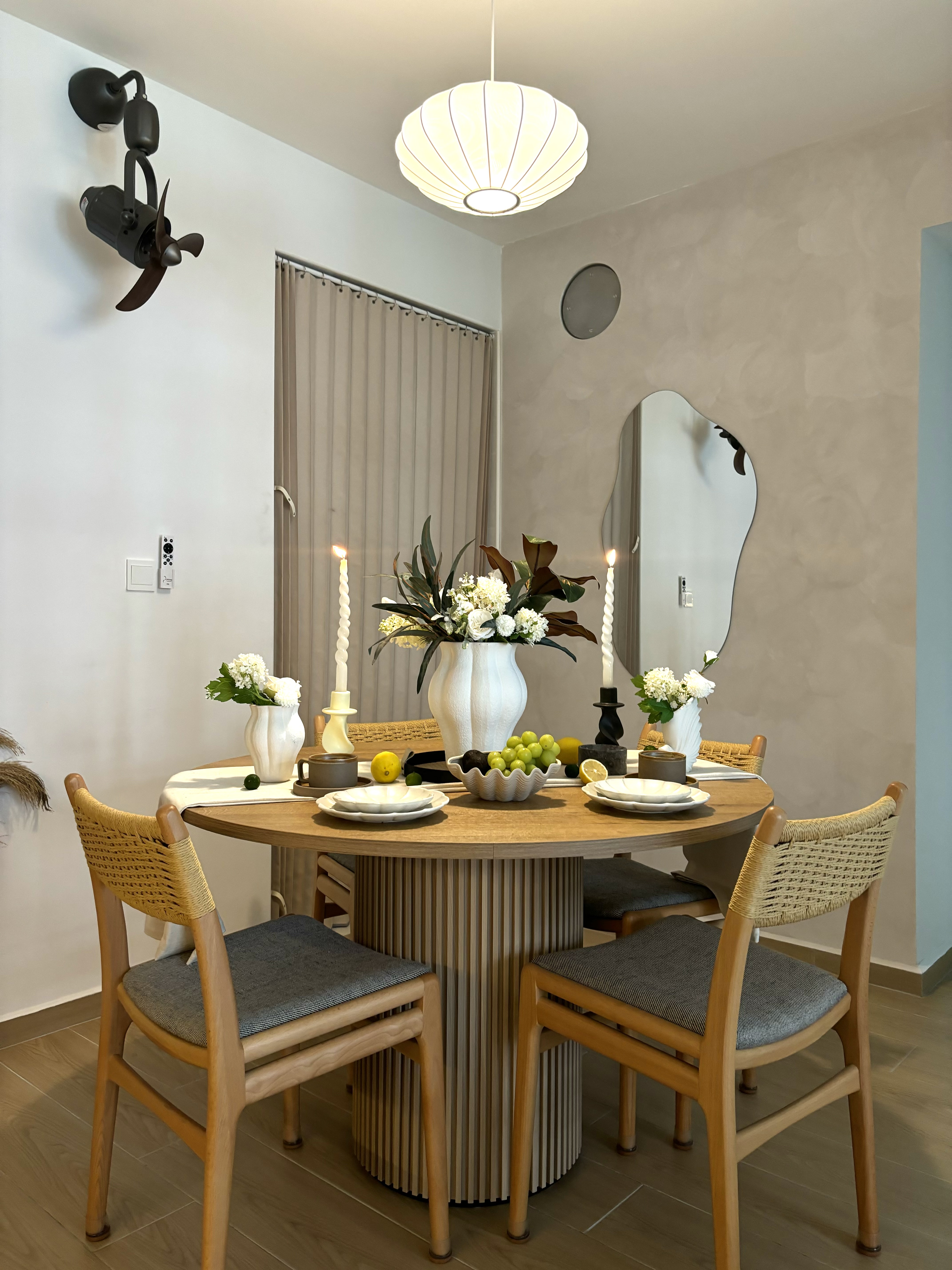 Our dining space: an area reserved for hosting meals - Modern dining room with elegant table setting, minimalist decor, round