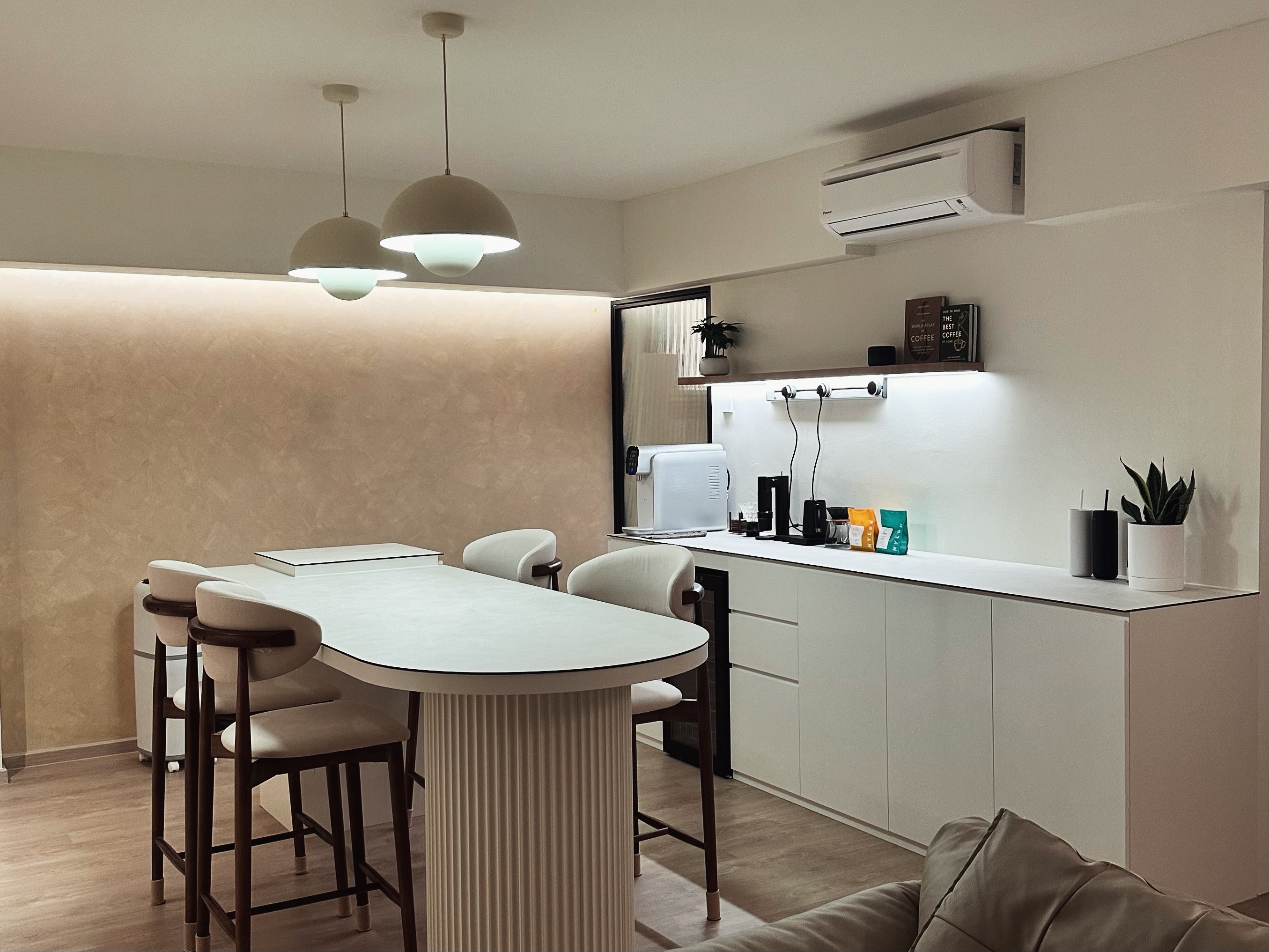 First week living in our 5 room home  - Modern kitchen with minimalist design, beige textured wall, round dining table with