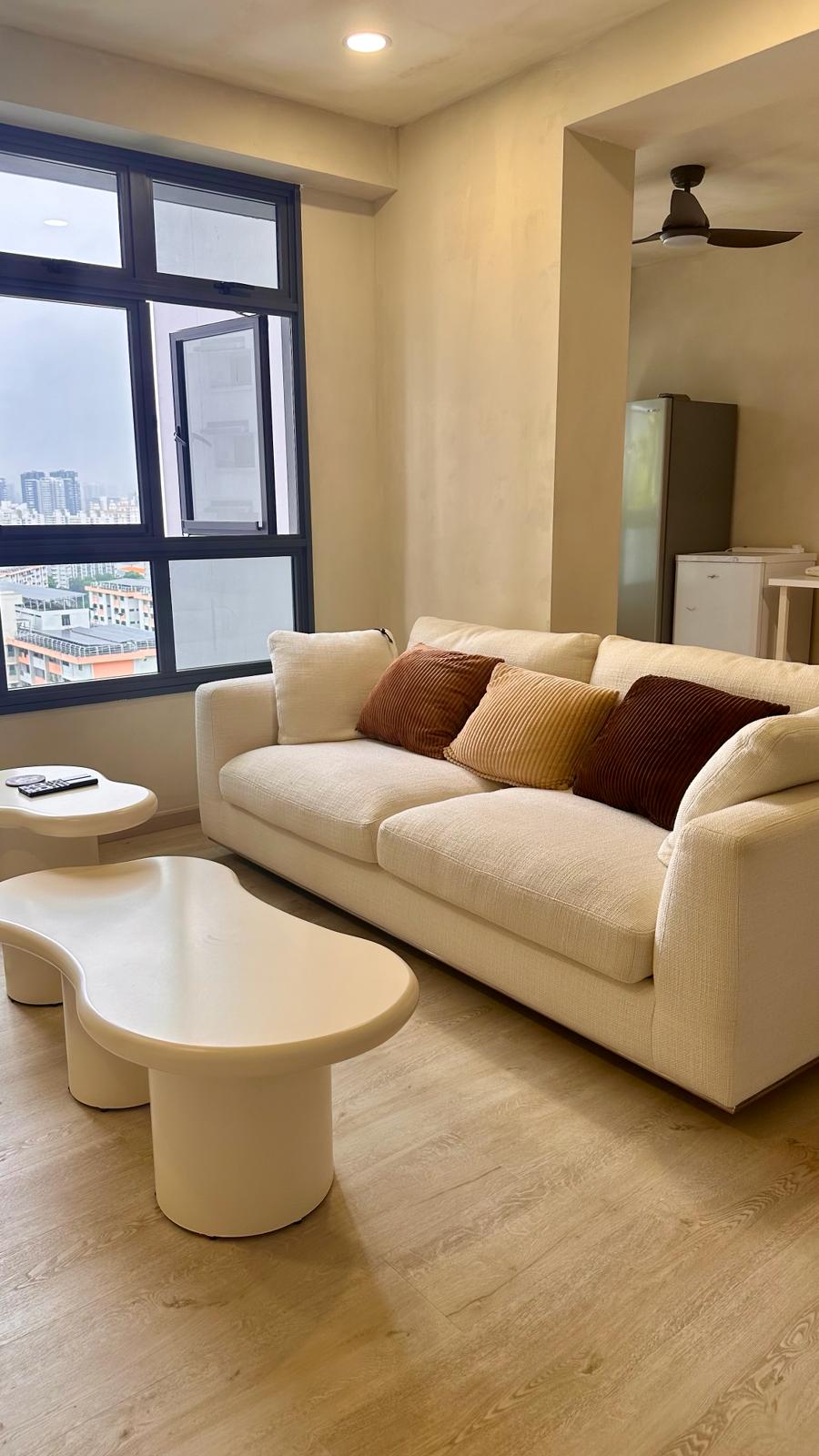 Wabi-Sabi home designed by Chefs to host Private Dinners - Modern living room with beige sofa, brown and beige pillows, large