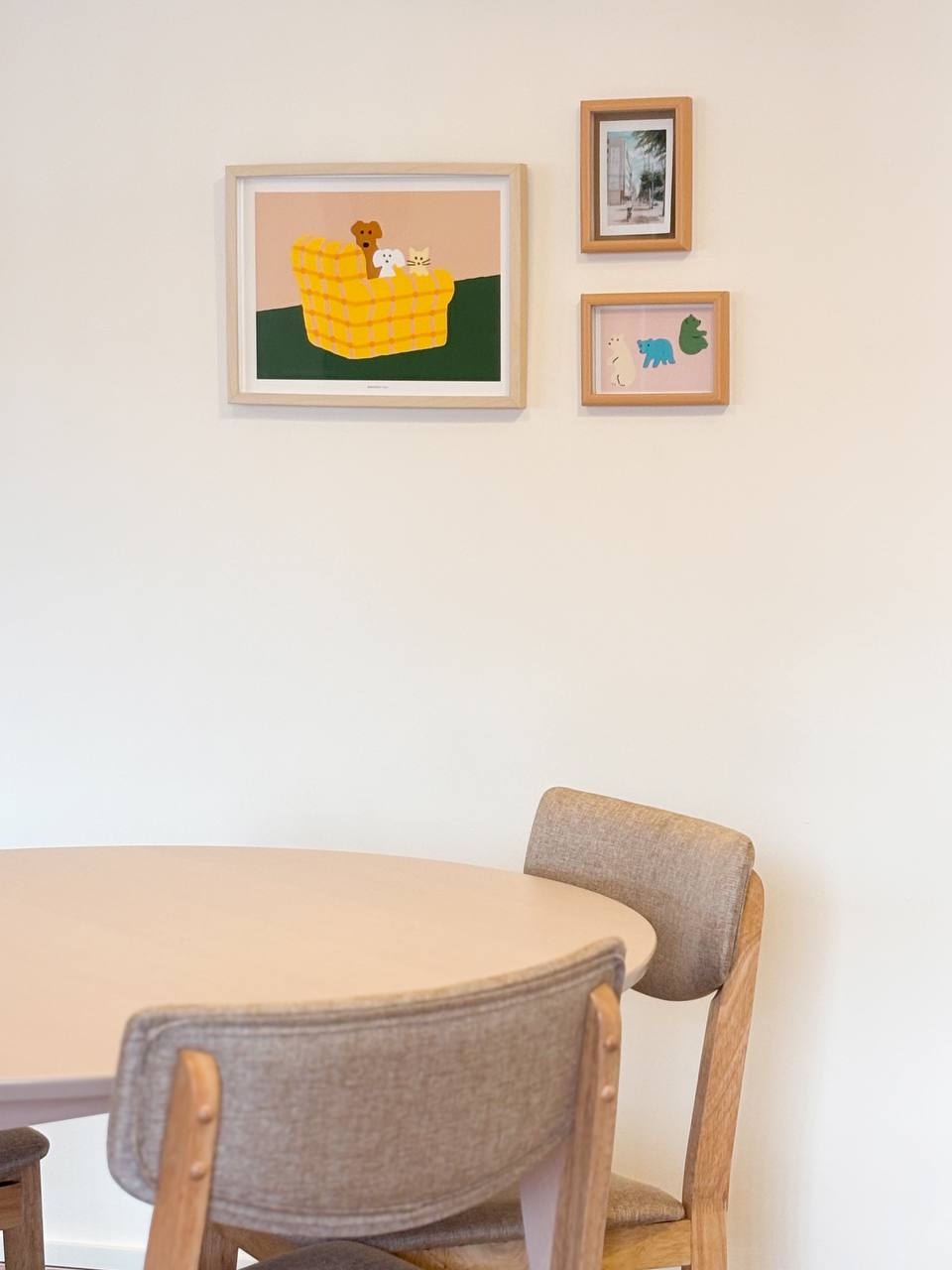 The Dining Area - Our Favourite Photo Spot - Minimalist dining room with a round table and light-colored chairs, Contemporary