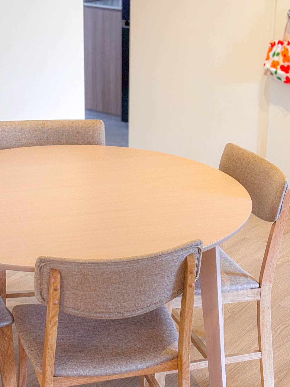 The Dining Area - Our Favourite Photo Spot - Round wooden table, beige upholstered chairs, minimalist interior, modern decor