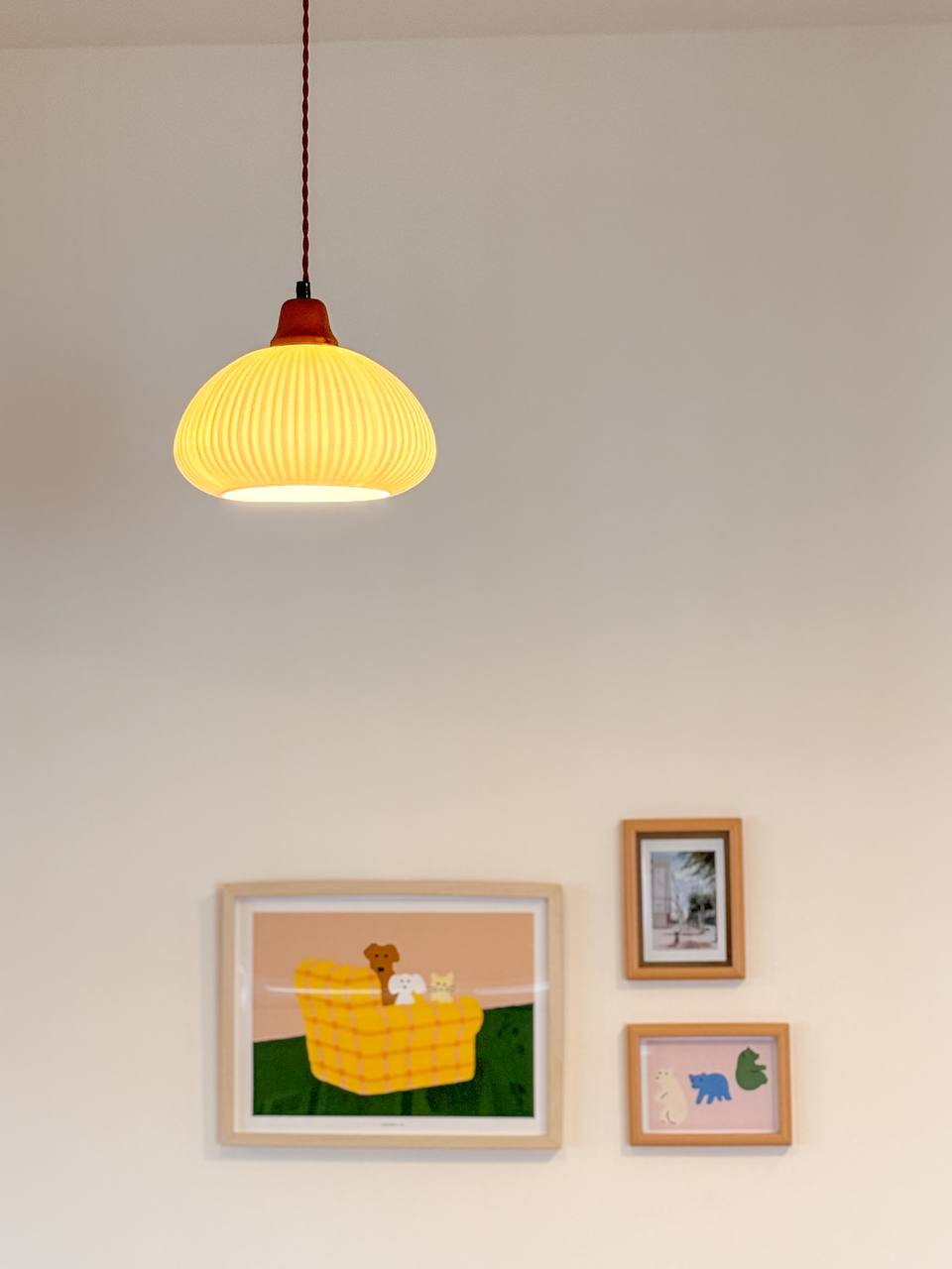 The Dining Area - Our Favourite Photo Spot - Yellow pendant light, minimalist decor, cozy atmosphere, playful artwork
