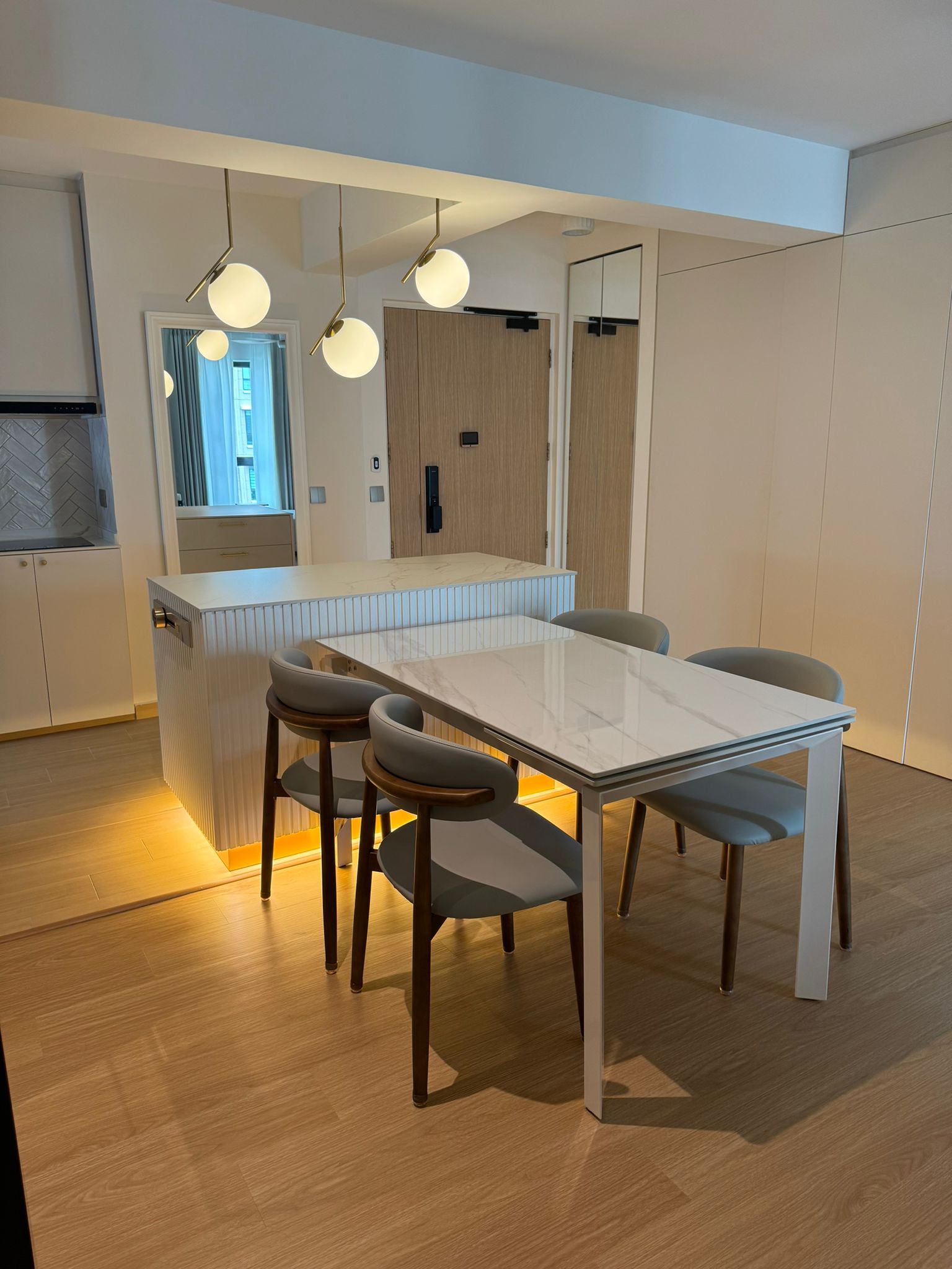 Dining Space: Modern luxury marble dining table connect with island - Modern kitchen with sleek design, minimalist decor