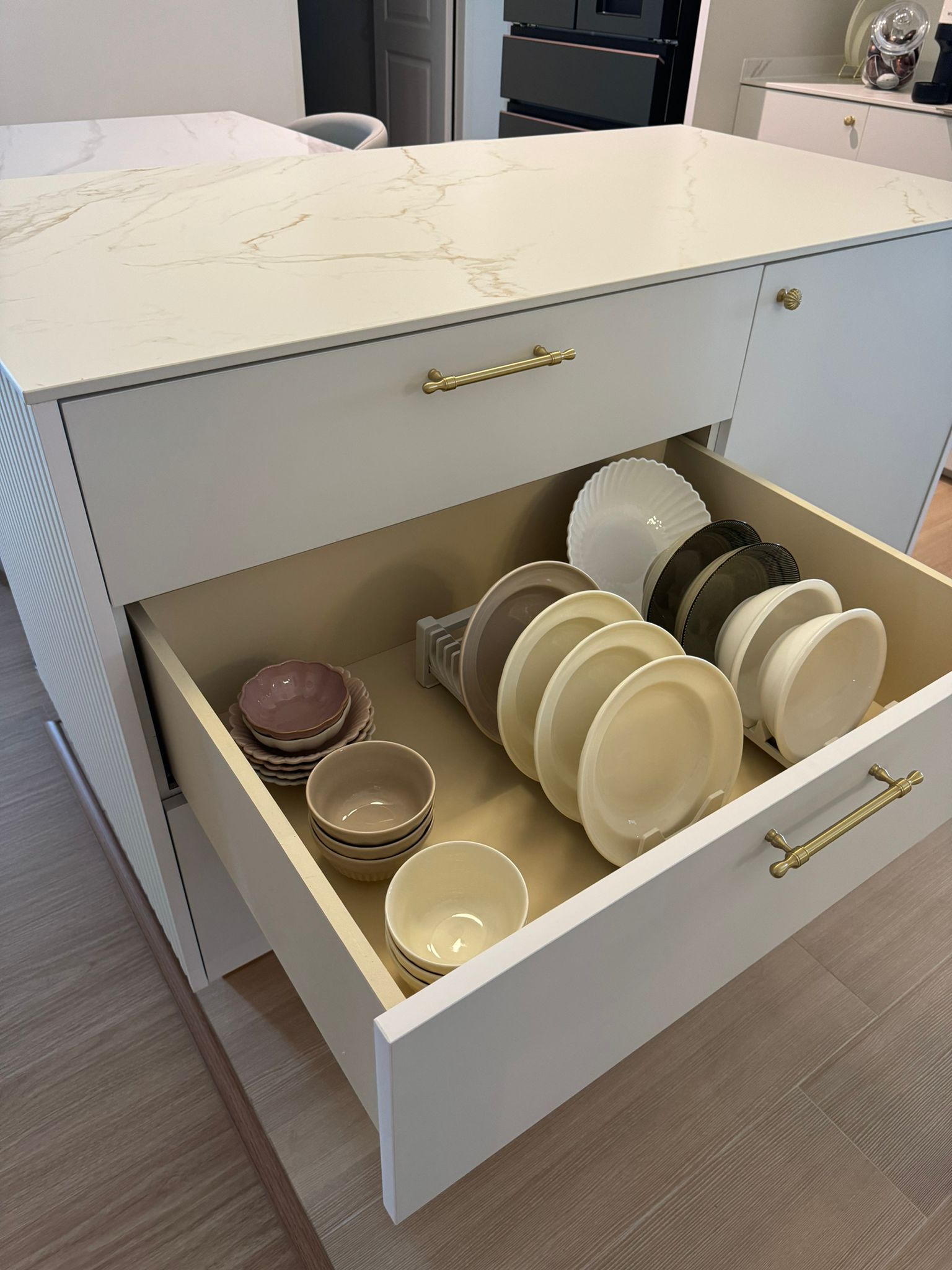 Dining Space: Modern luxury marble dining table connect with island - White marble countertop, gold handles, modern kitchen