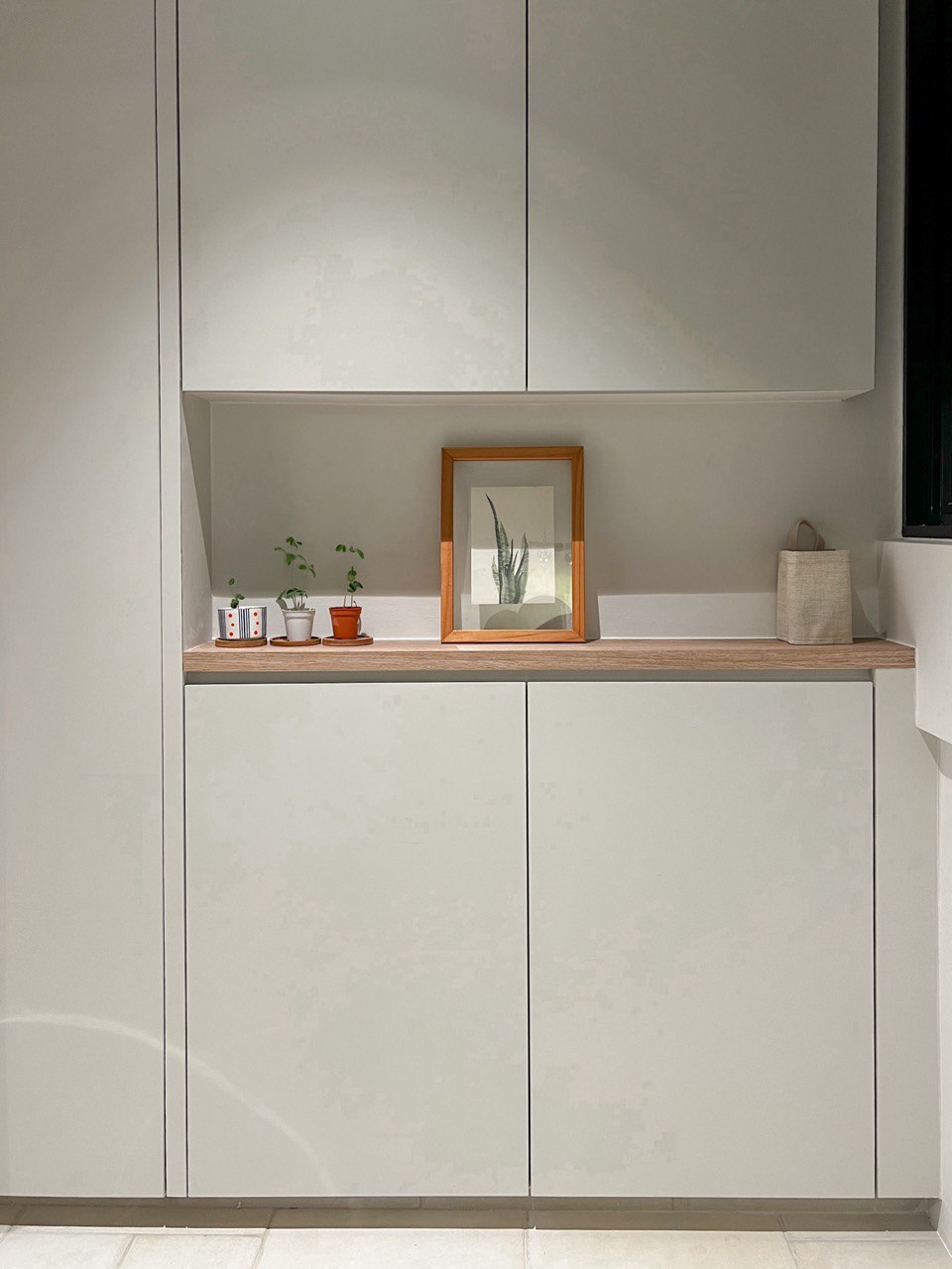 A Modern Farmhouse - Light-colored cabinets, minimalist design, modern decor, small indoor plants, wooden countertop, white