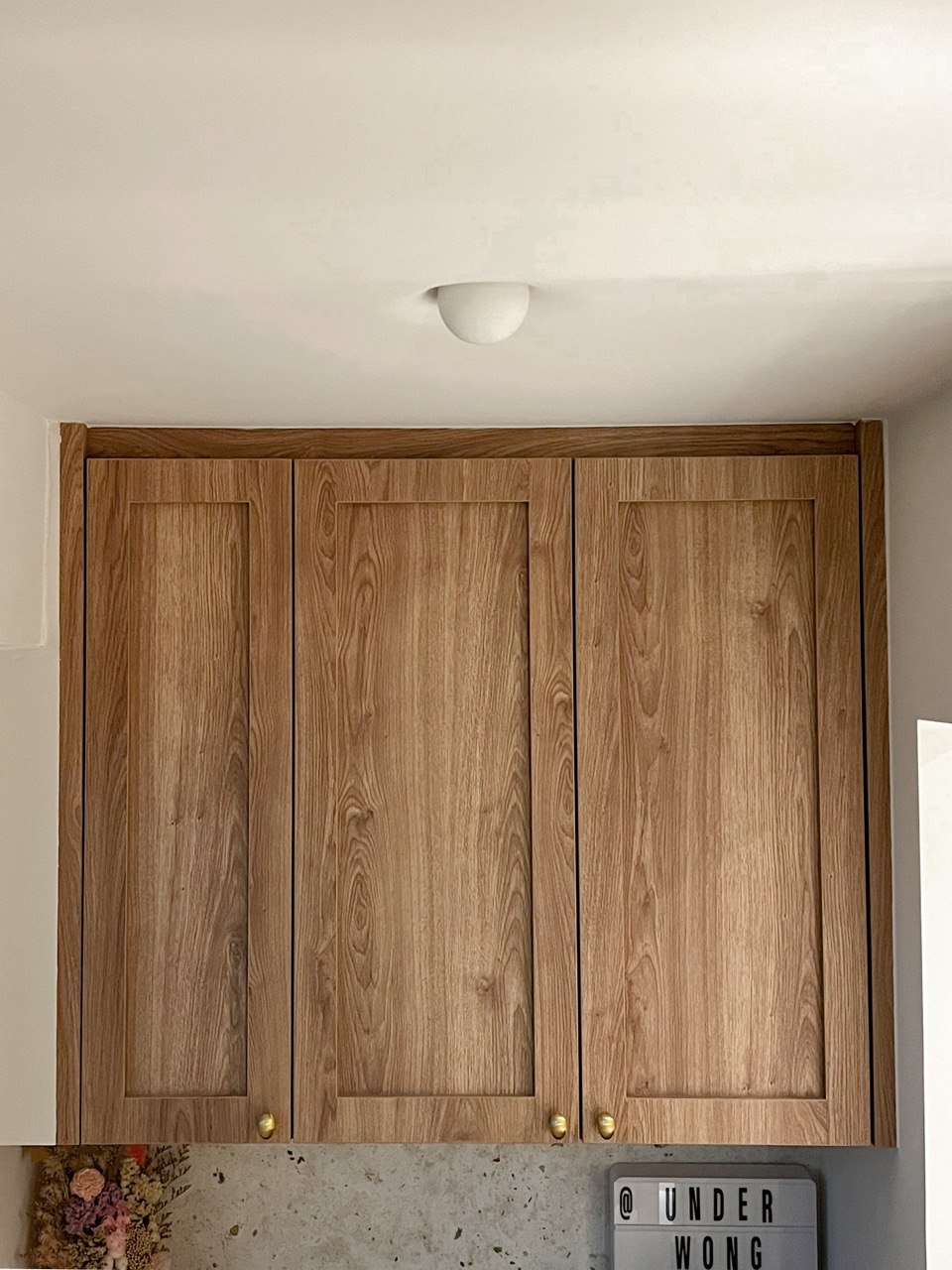 A Modern Farmhouse - Wooden kitchen cabinets, minimalist design, natural wood finish, upper and lower cabinets, recessed