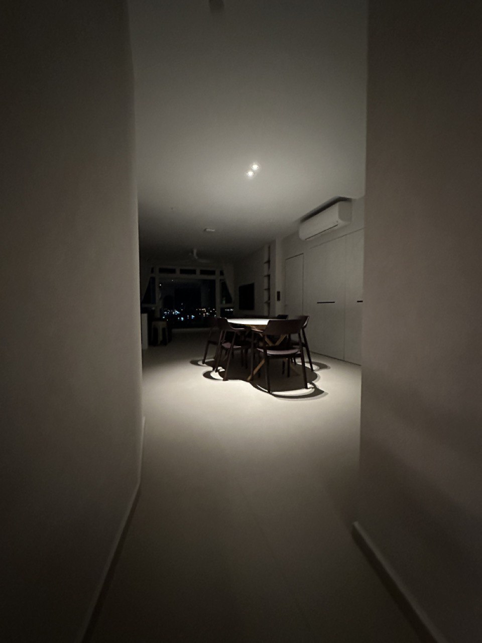 Dining Space with Minimalist Embrace - dimly lit hallway, modern dining room, minimalist design, sleek furniture, wooden
