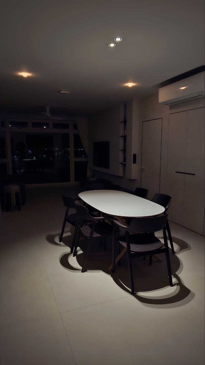 Dining Space with Minimalist Embrace - Modern minimalist dining room, sleek white table, black chairs, dimly lit room