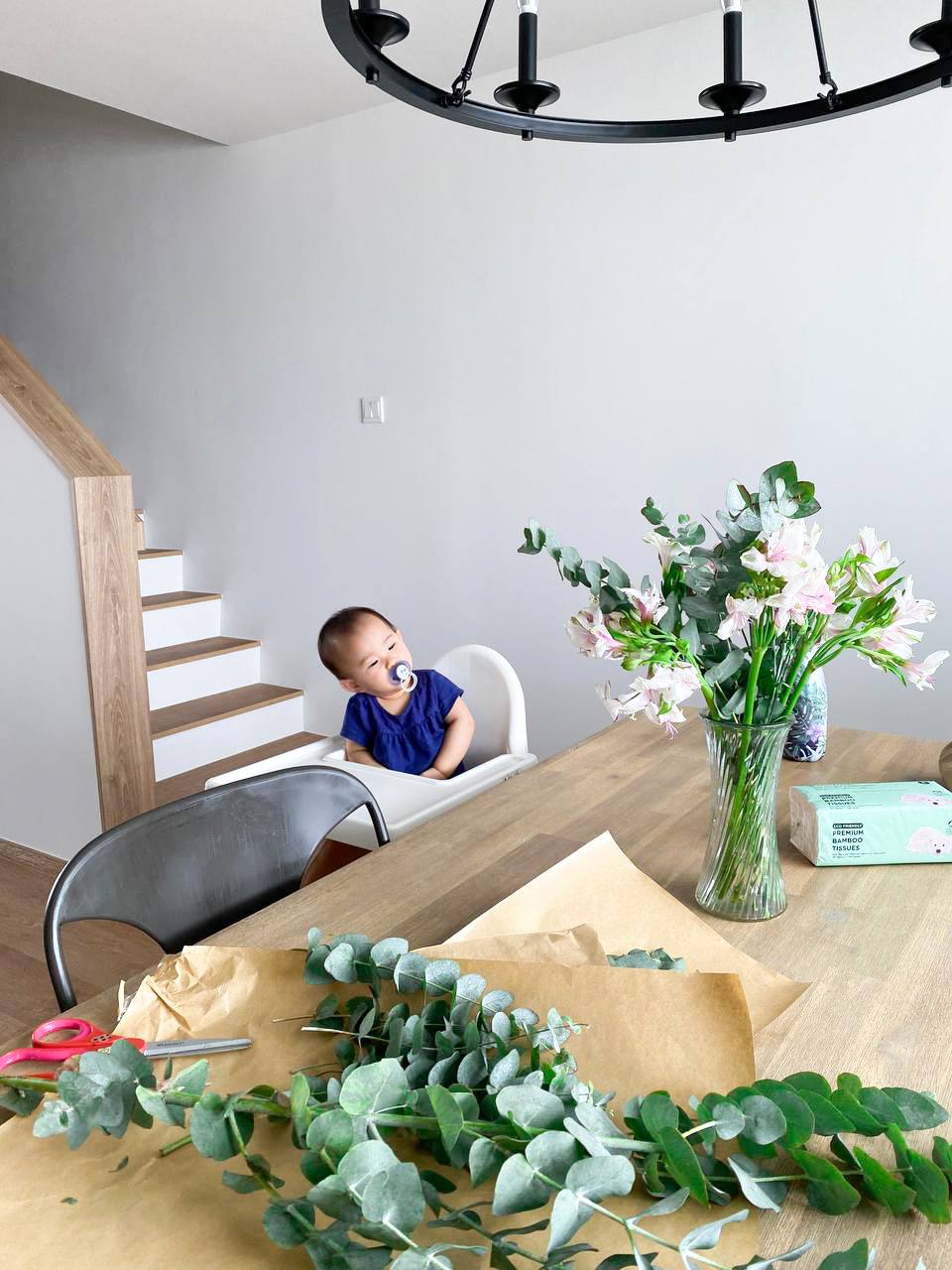 A modern farmhouse dining area - where we come together - modern dining room, baby sitting, wooden table, baby bottle, baby