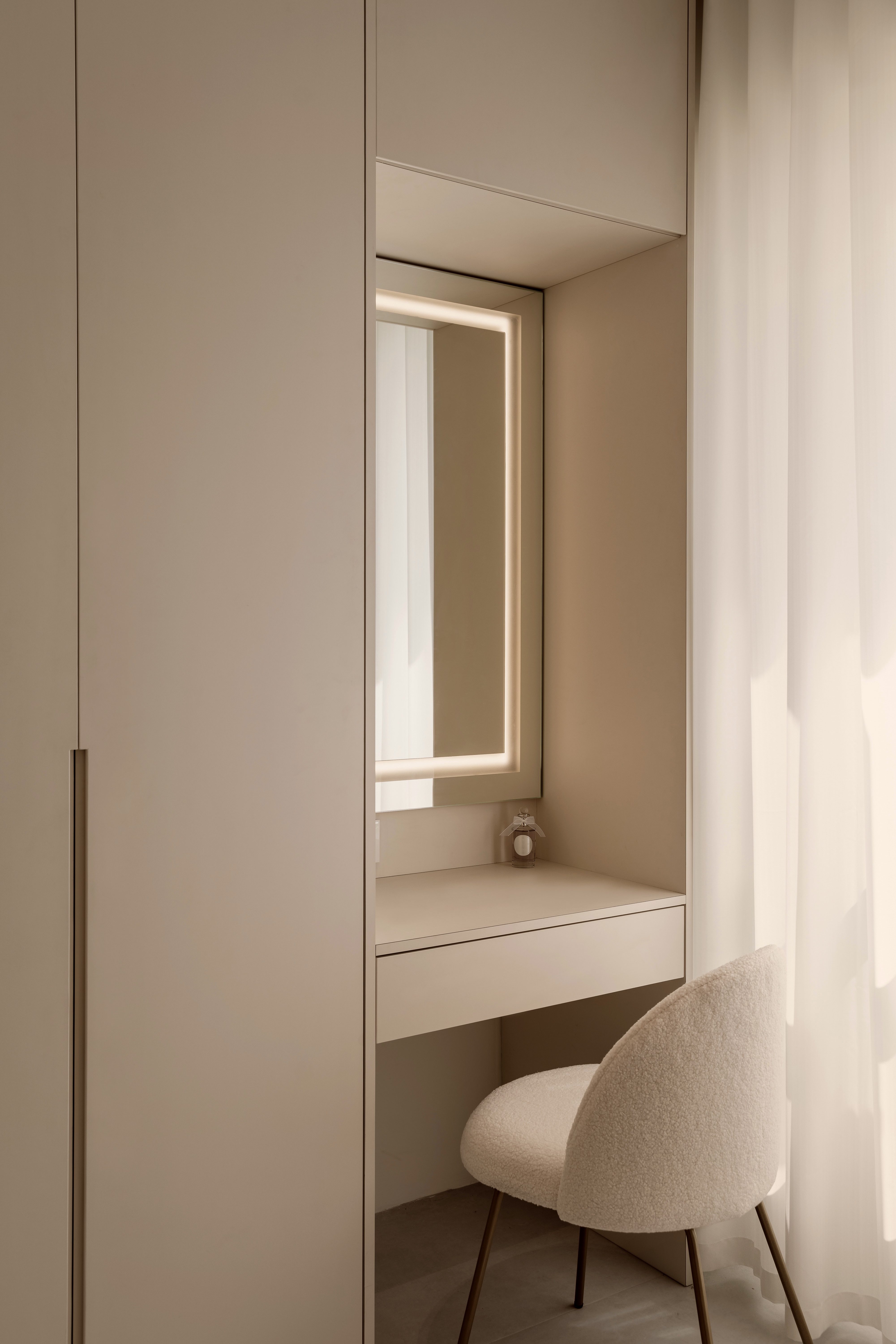 A Creamy Home With Sunrise View  - Minimalist vanity with integrated lighting, beige color scheme, modern design, sleek