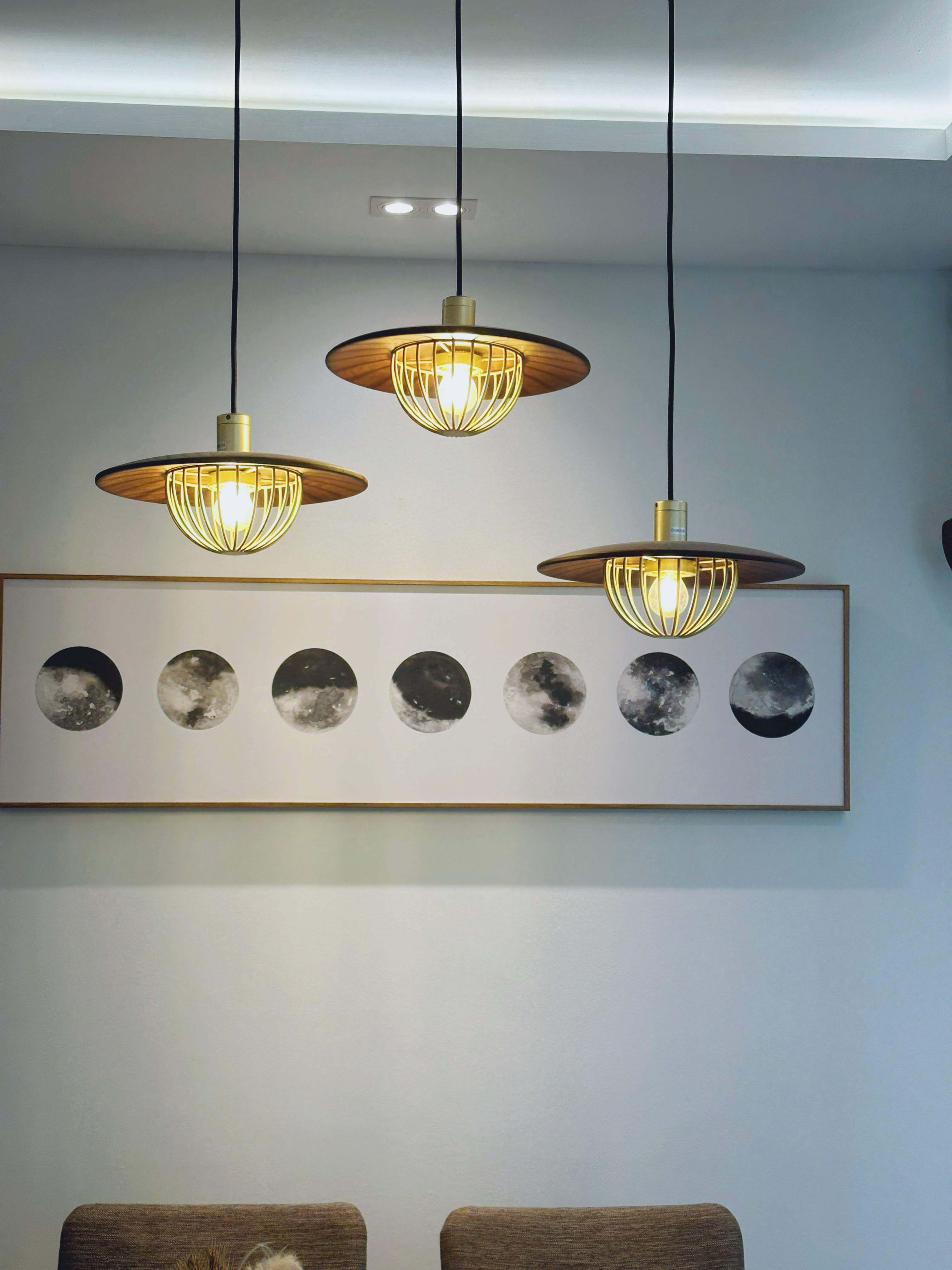 "You can always count on tables to bring people together"  - Modern pendant lights with warm glow, minimalist design