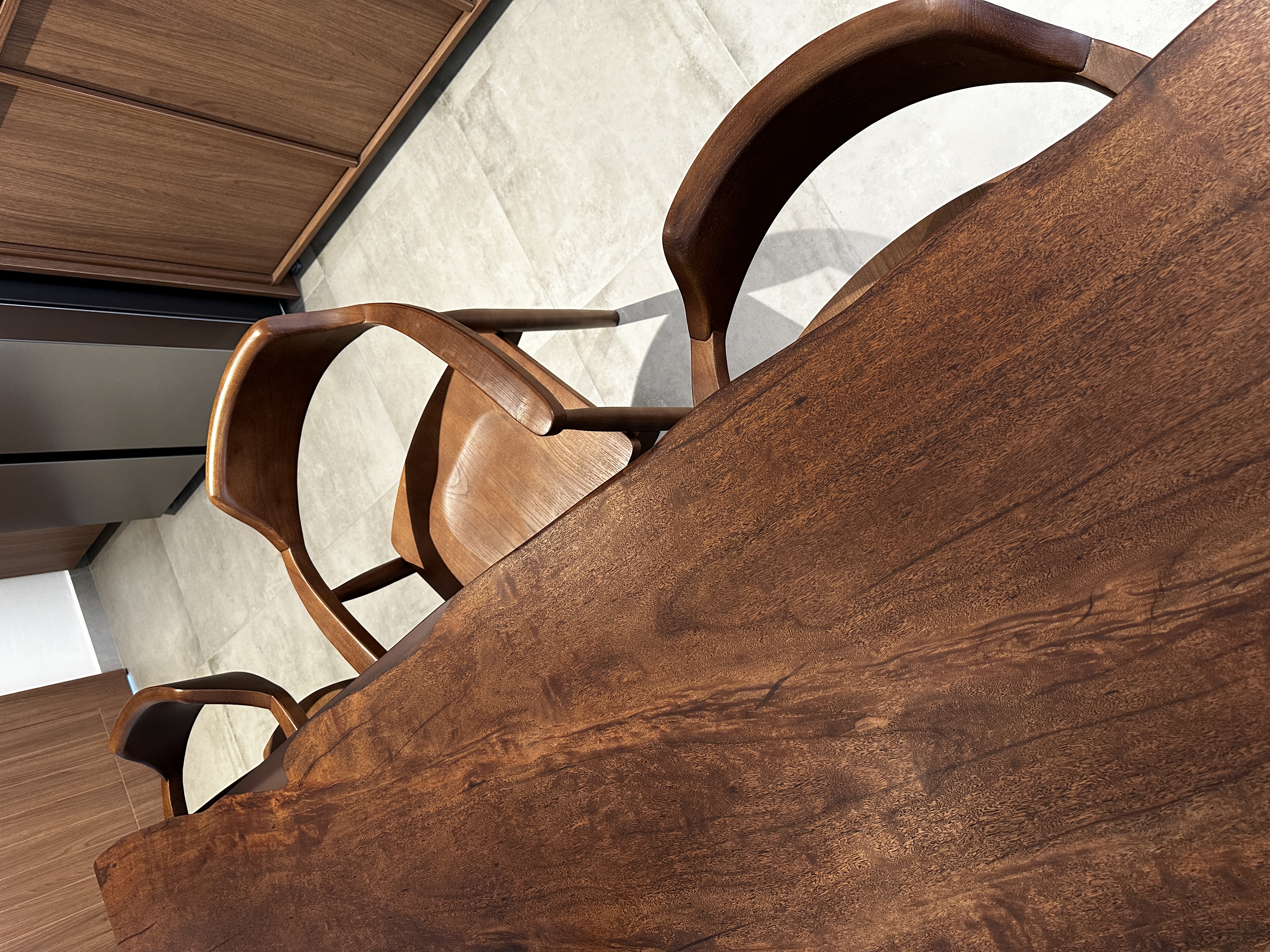 Our Dining Room: Japandi style with raw details - Wooden chair, modern design, rich brown finish, curved armrests, sleek