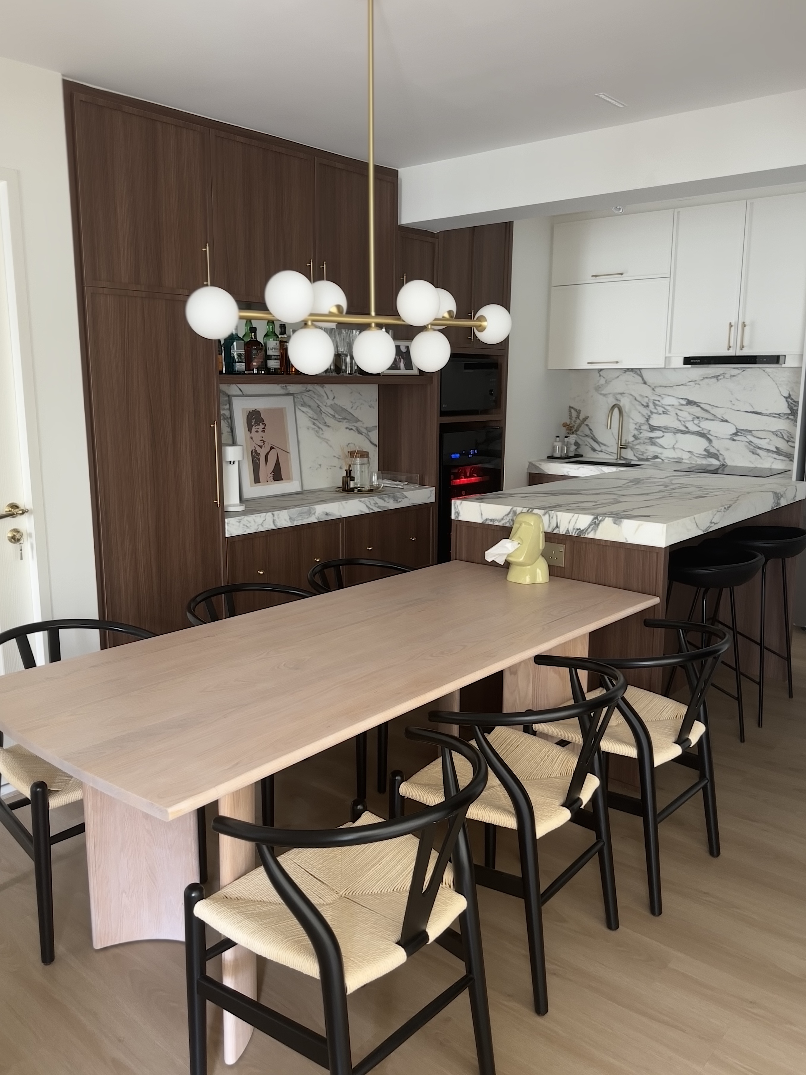 Entertain in Style: Island, Bar, and a 2m Long Dining Table  - Wooden dining table, black metal chairs, modern kitchen