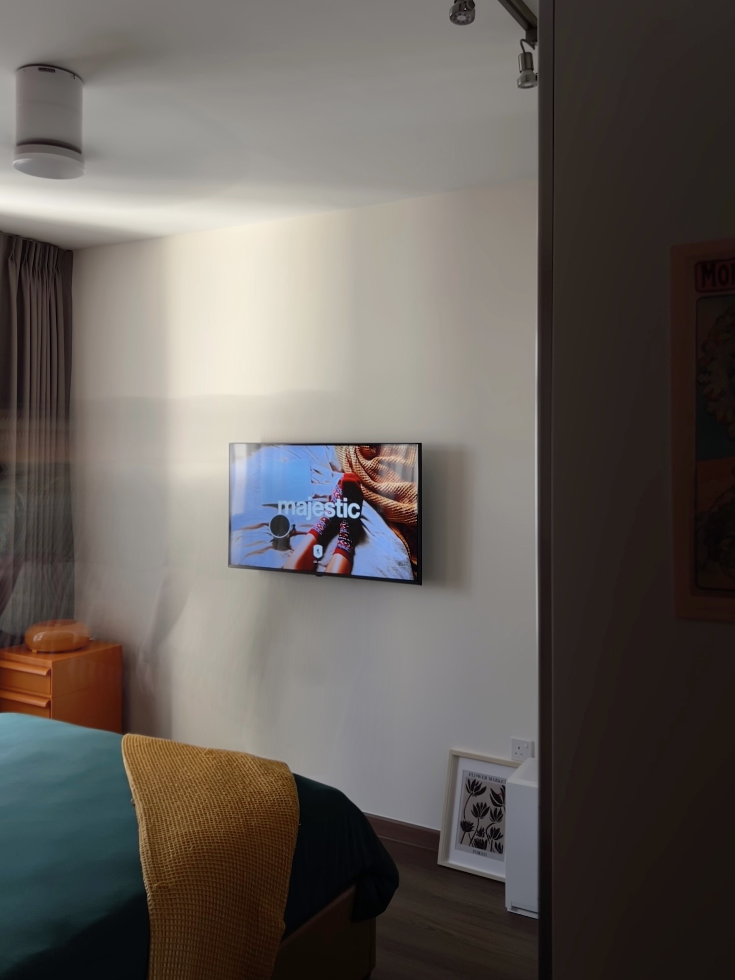 Our bedroom: A cosy escape into slumber  - Modern minimalist bedroom, cozy bed with teal and yellow bedding, bedside table