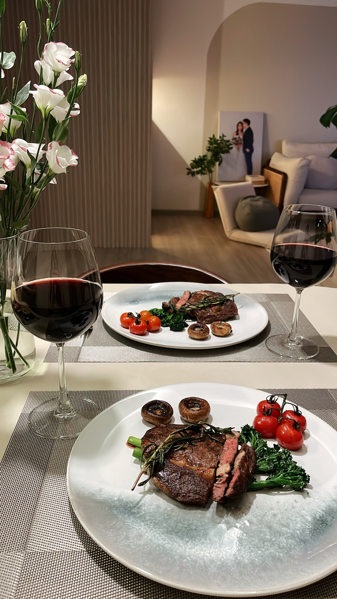 Our Dining Room:  where every meal becomes a cherished memory - White flowers, elegant dining table, wine glasses, gourmet