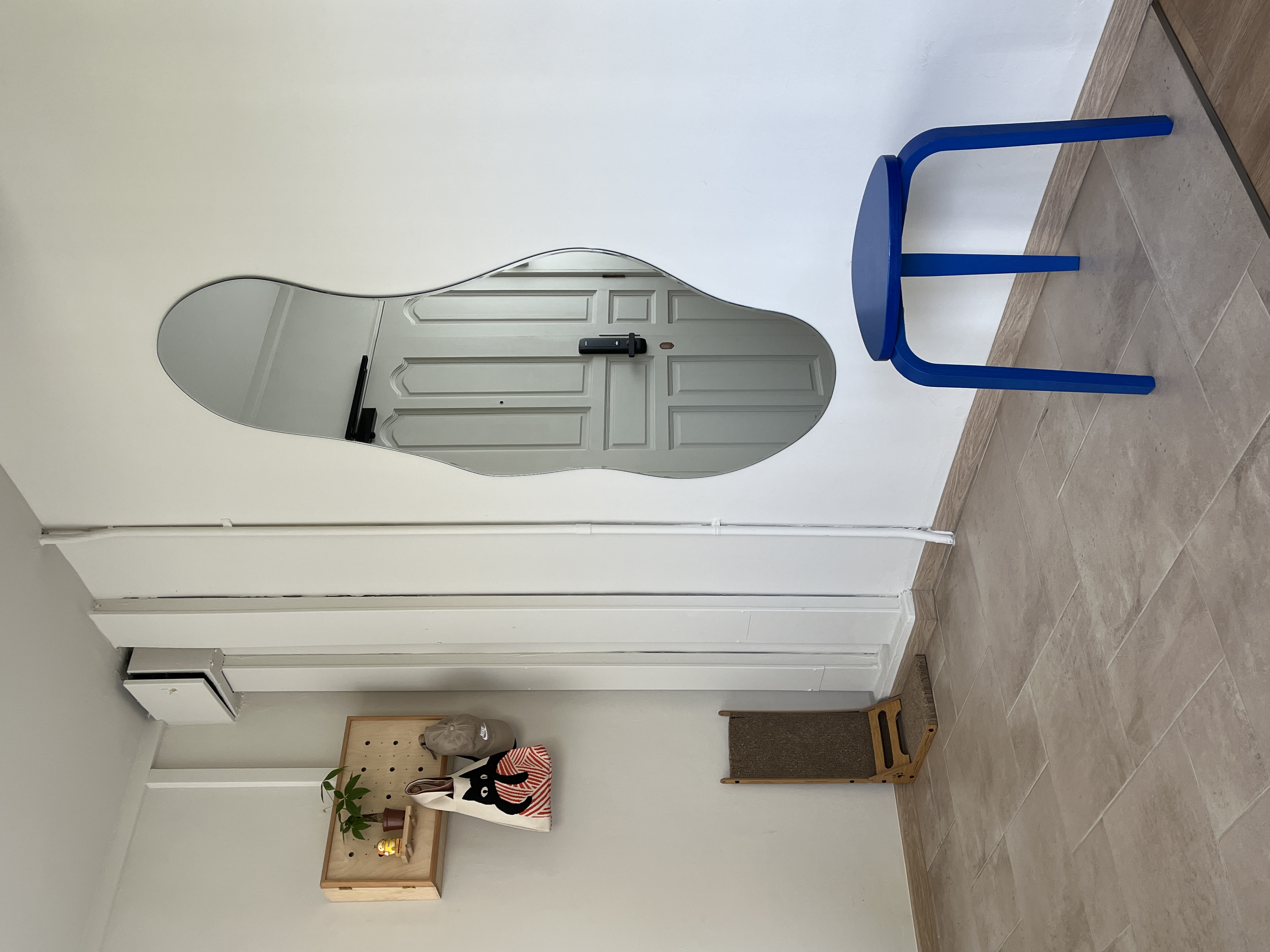 Entryway - Clean & Simple - modern minimalist interior, white ceiling, geometric design, blue chair, wooden shelf, small