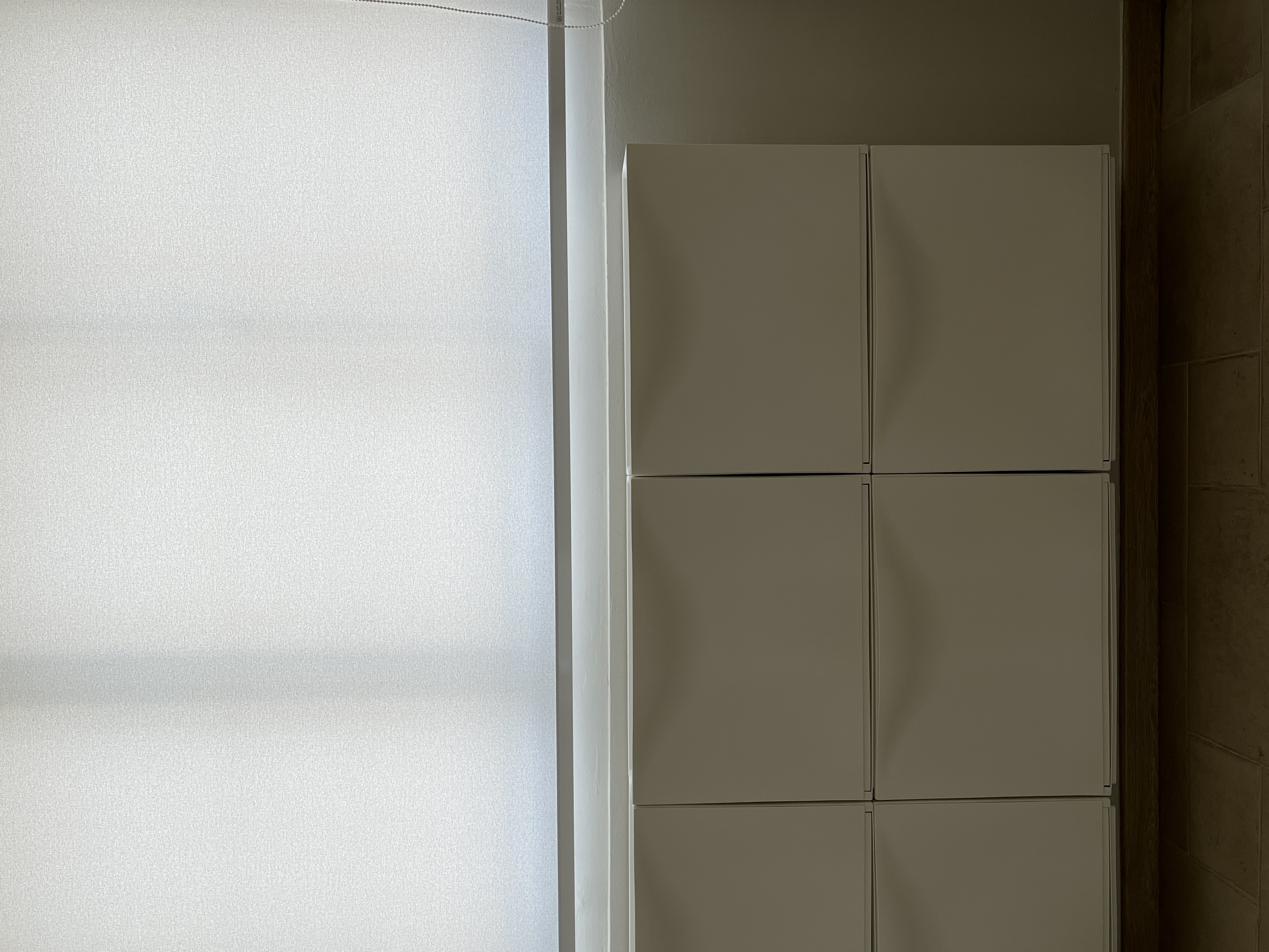 Entryway - Clean & Simple - Light-filtering window, minimalist design, white cabinets, modern kitchen, sleek appliances