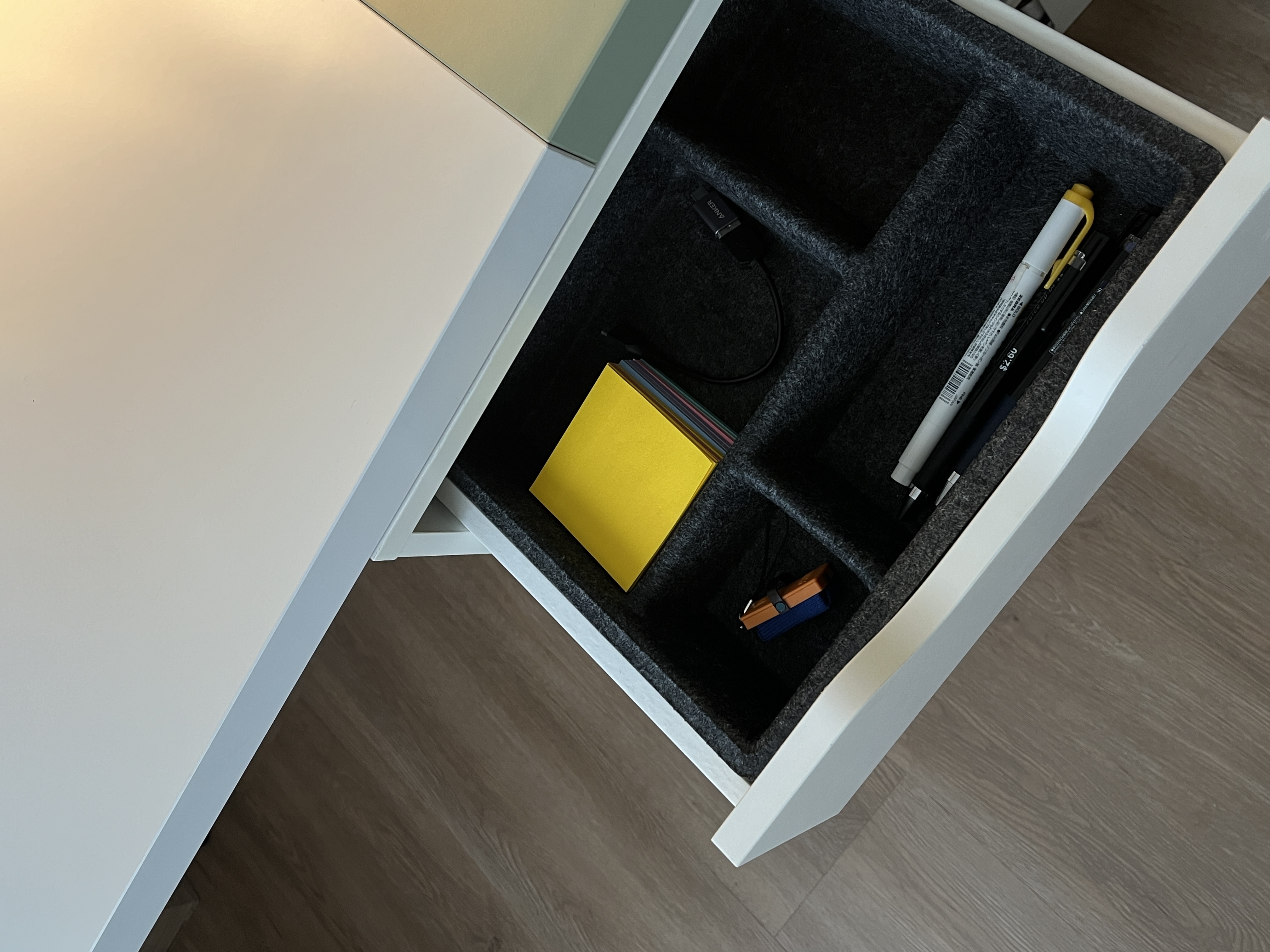 Multi-Functional Space: The Workspace Guest Room - desk drawer, neatly organized, black storage, foam lining, yellow