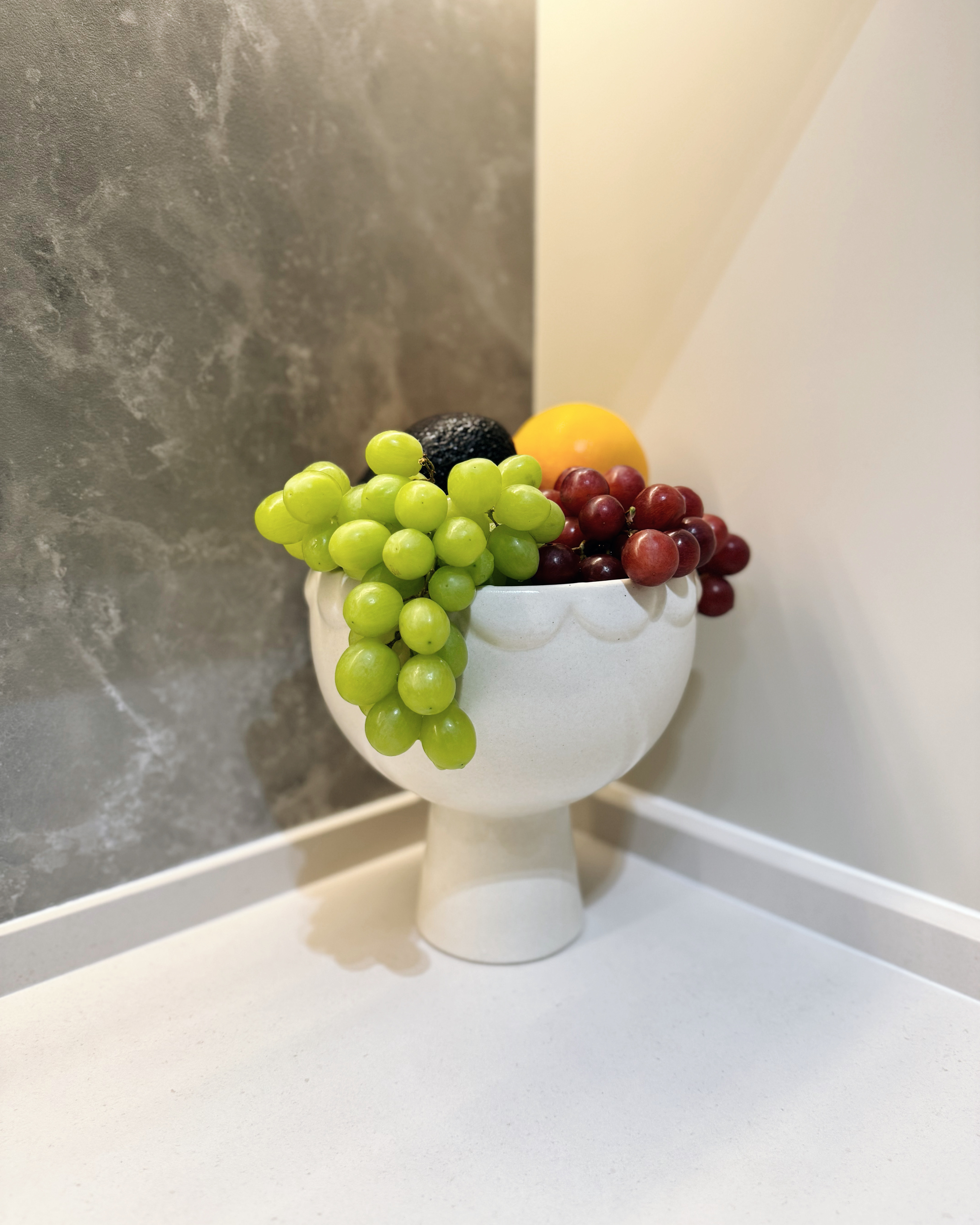 Beyond Meals: Crafting Memories in Dining Room and Kitchen Spaces - Grapes, yellow ball, black avocado, red grapes, white