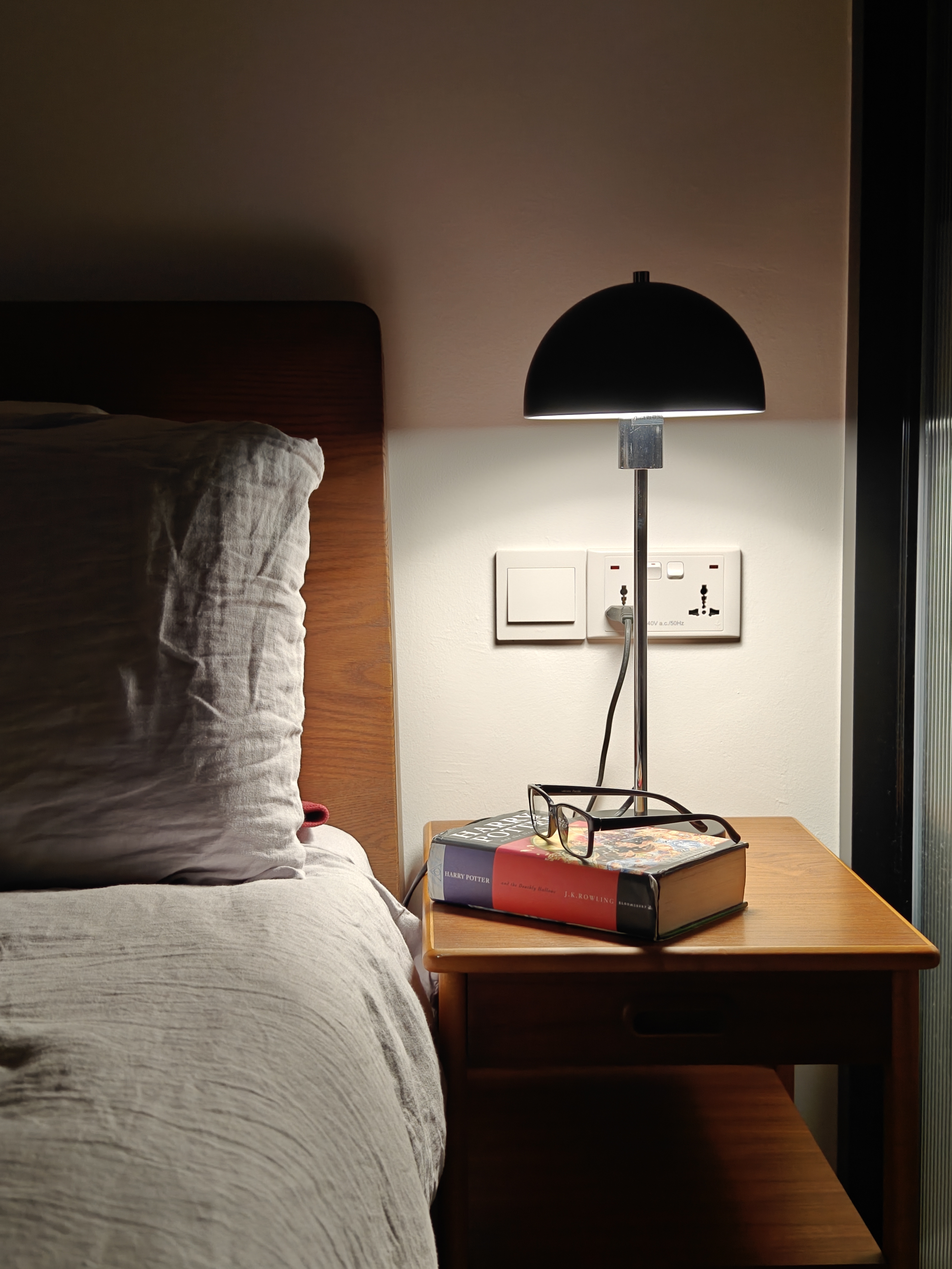 Dream A Little Dream Of Me - Bedside nightstand, bedside table, soft lighting, lamp, books, glasses, cozy room, comfortable