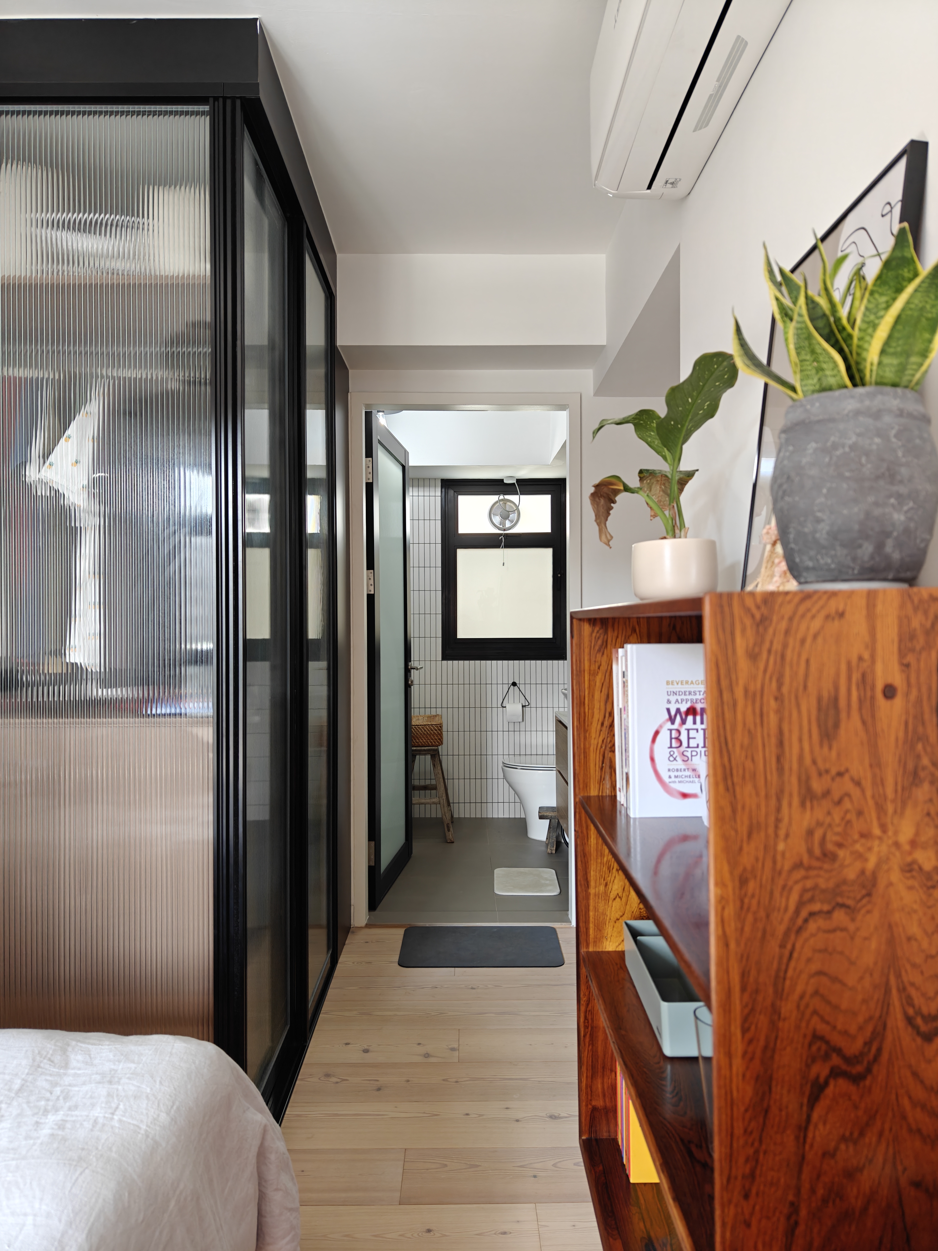 Dream A Little Dream Of Me - Modern bathroom interior, minimalist design, white tiled walls, black-framed window, wooden