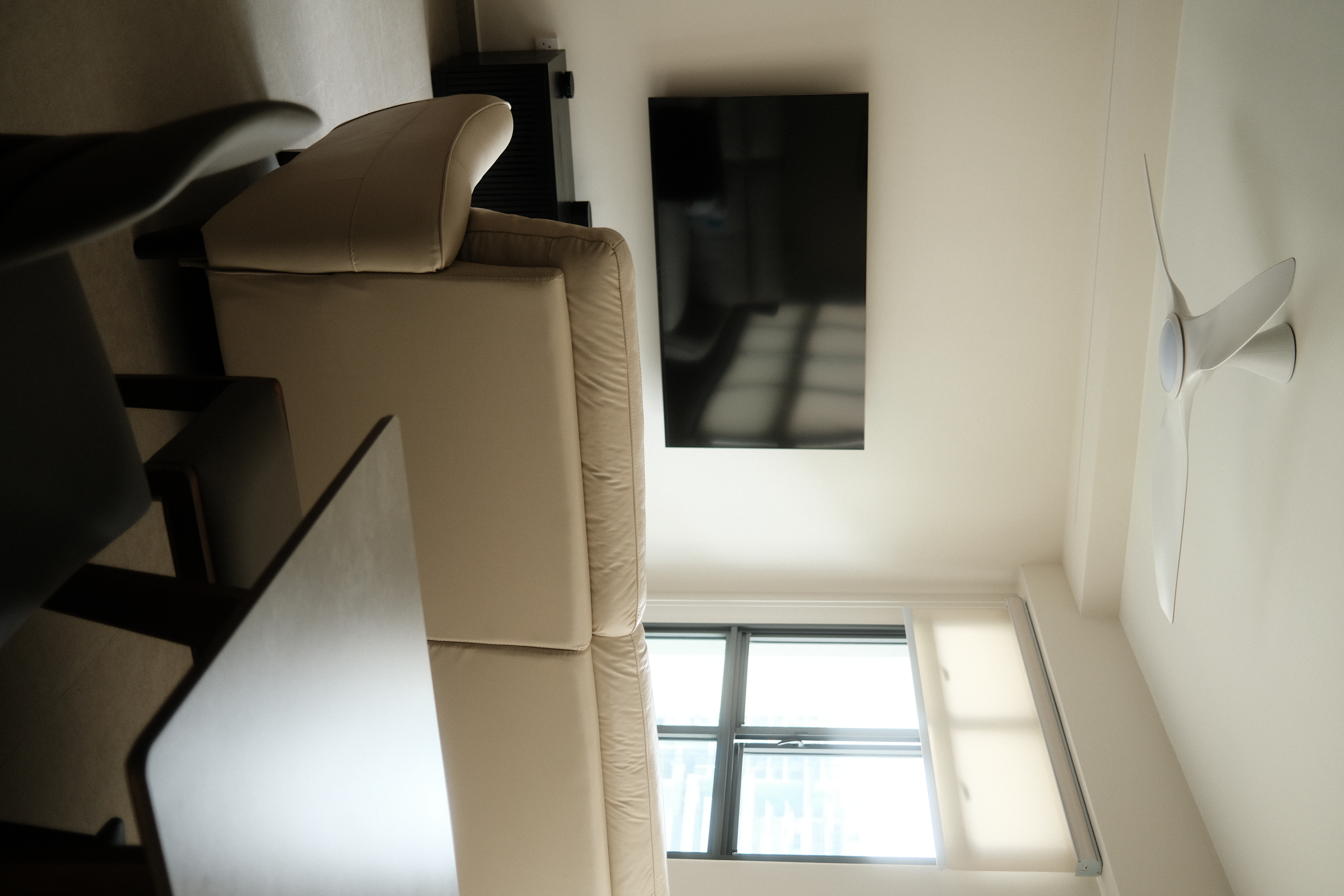 Dining space: Weaving conversations between meals - Modern living room, minimalist design, beige sofa, black television