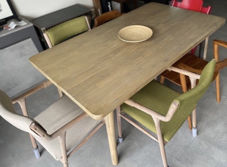 Hearty Meals, Warm Hearts: Our DIY Thrifted Dining Table  - Wooden dining table with green upholstered chairs, minimalist