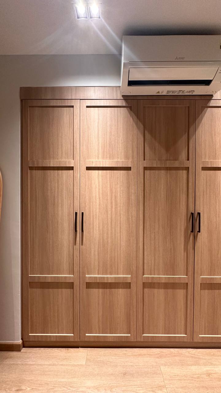 Bedroom Made For A Restful Night 🌙🛏️ - Wooden wardrobe, modern design, closed doors, light brown finish, built-in shelving