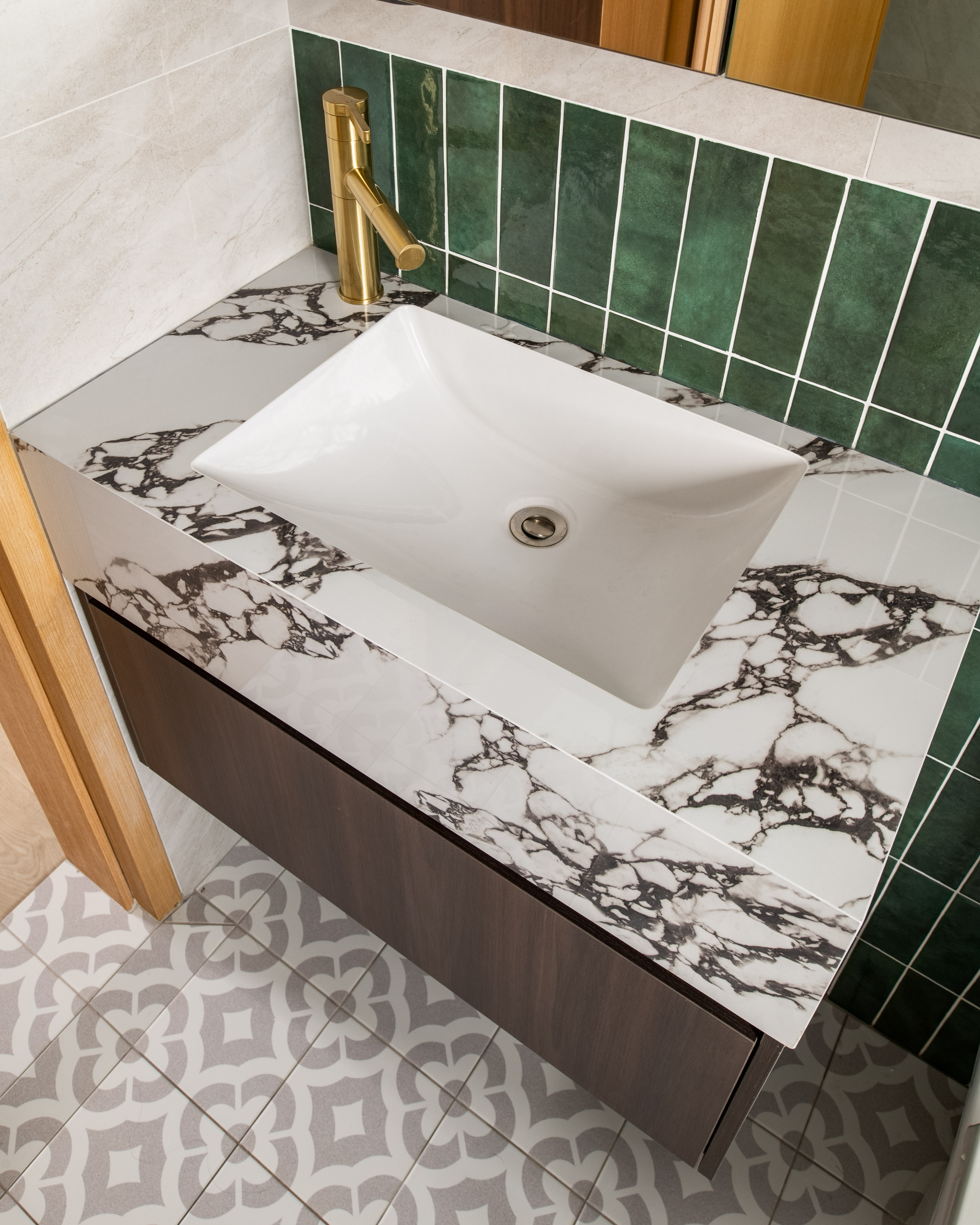 Building our dream Modern Farmhouse bathroom - White marble countertop, green tiled backsplash, gold faucet, modern bathroom