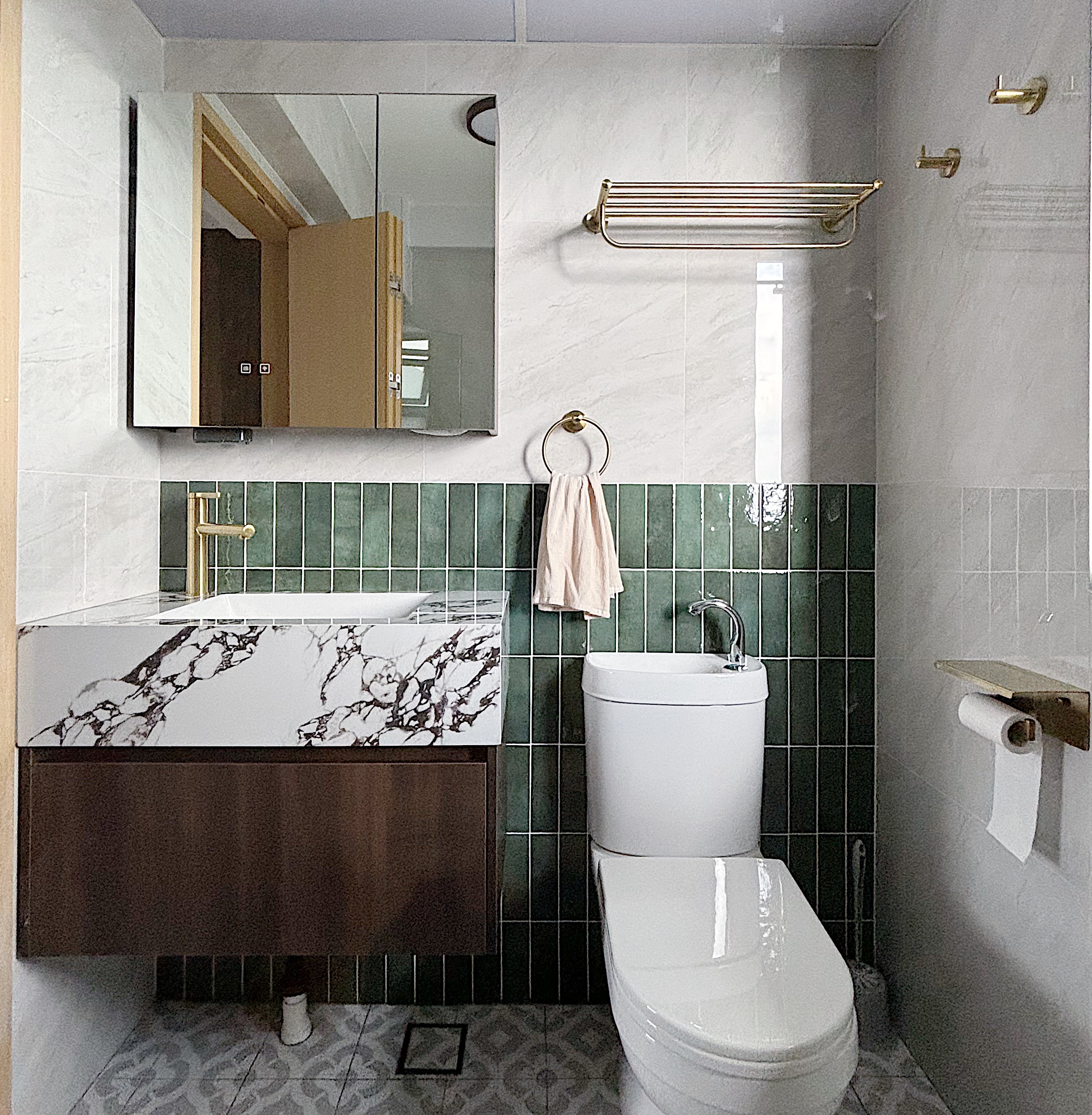 Building our dream Modern Farmhouse bathroom - White marble countertop, gold faucet, green tiled backsplash, wooden vanity