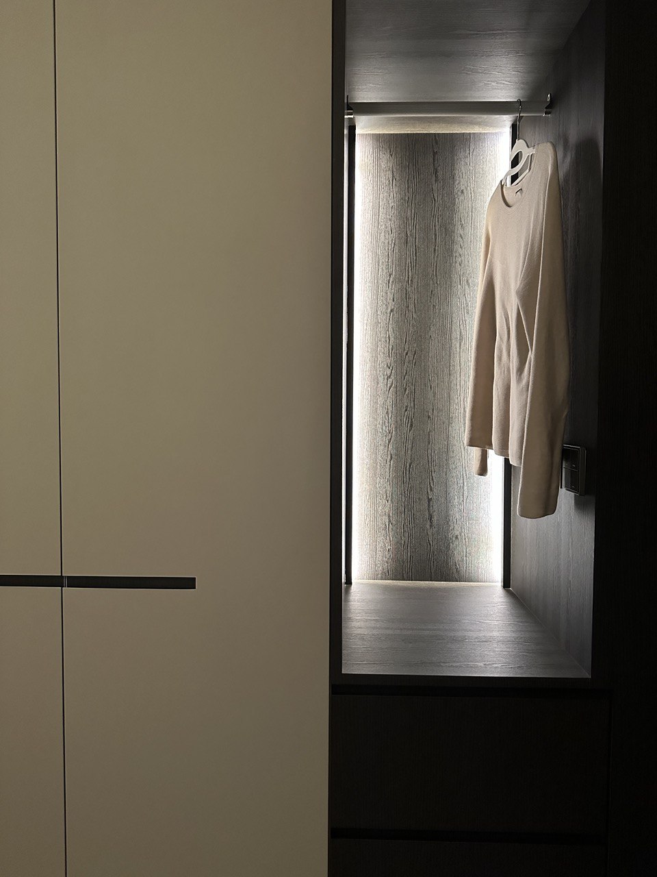 Simple Bedroom for us and the Sandman - Minimalist wardrobe space, neutral color palette, modern design, sleek black rod