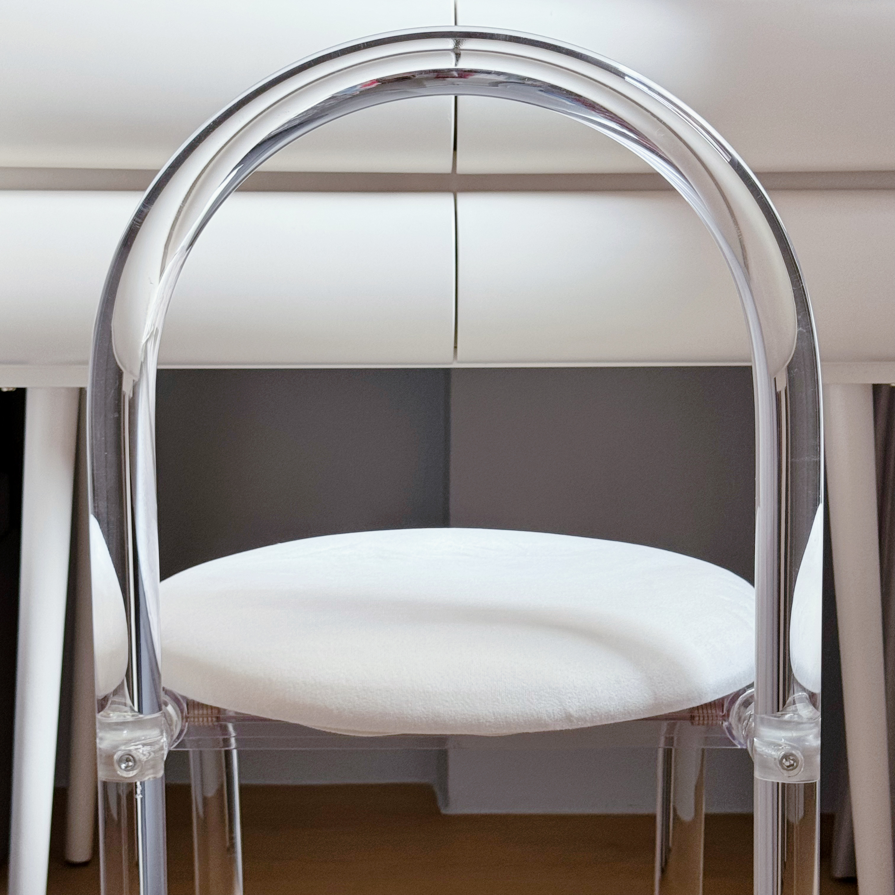 Peek into the tofus' recharging station! 💤  - Clear chair frame, chrome arch, white cushion, modern design, sleek structure