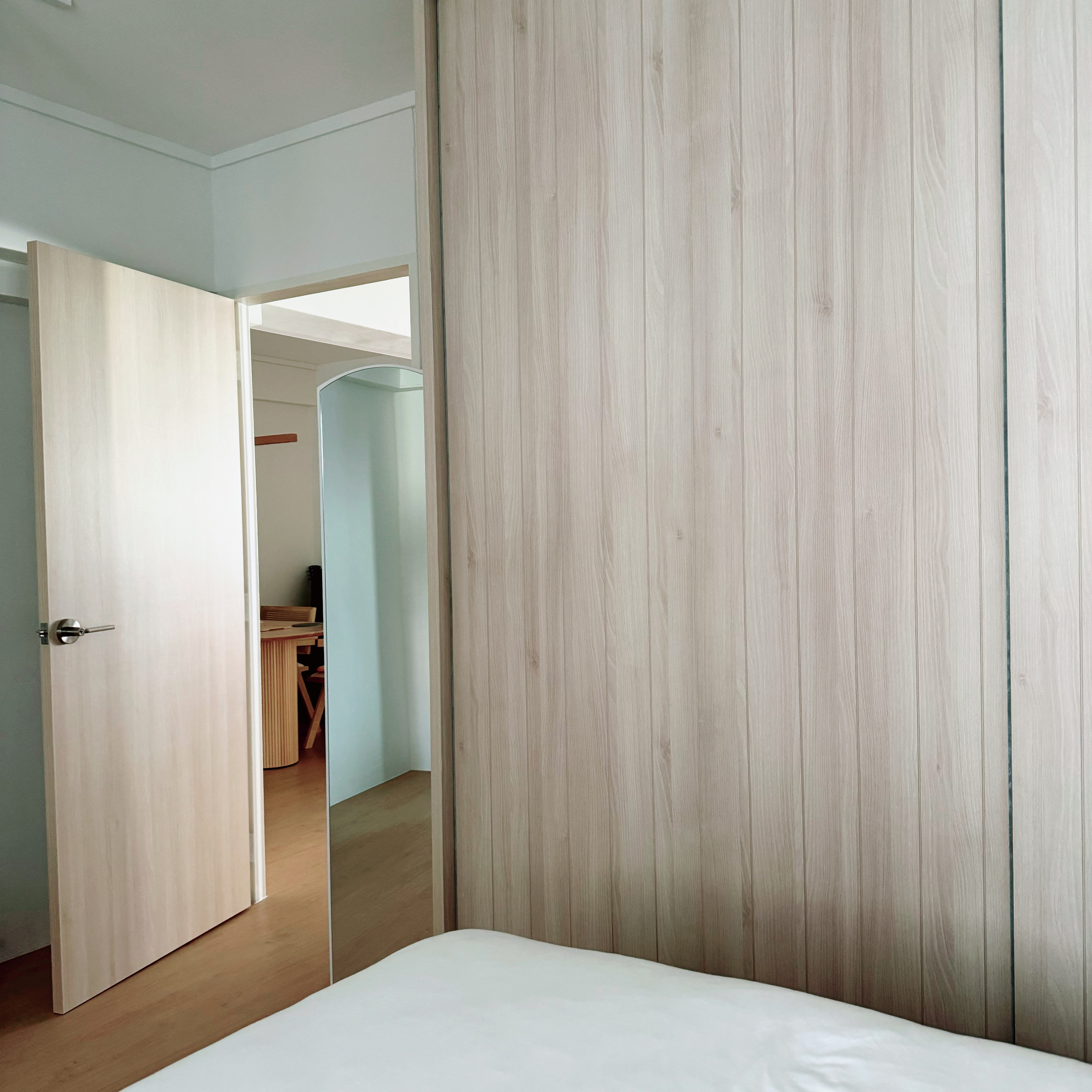Peek into the tofus' recharging station! 💤  - Light wooden wardrobe, open door, light-colored wooden paneling, minimalist