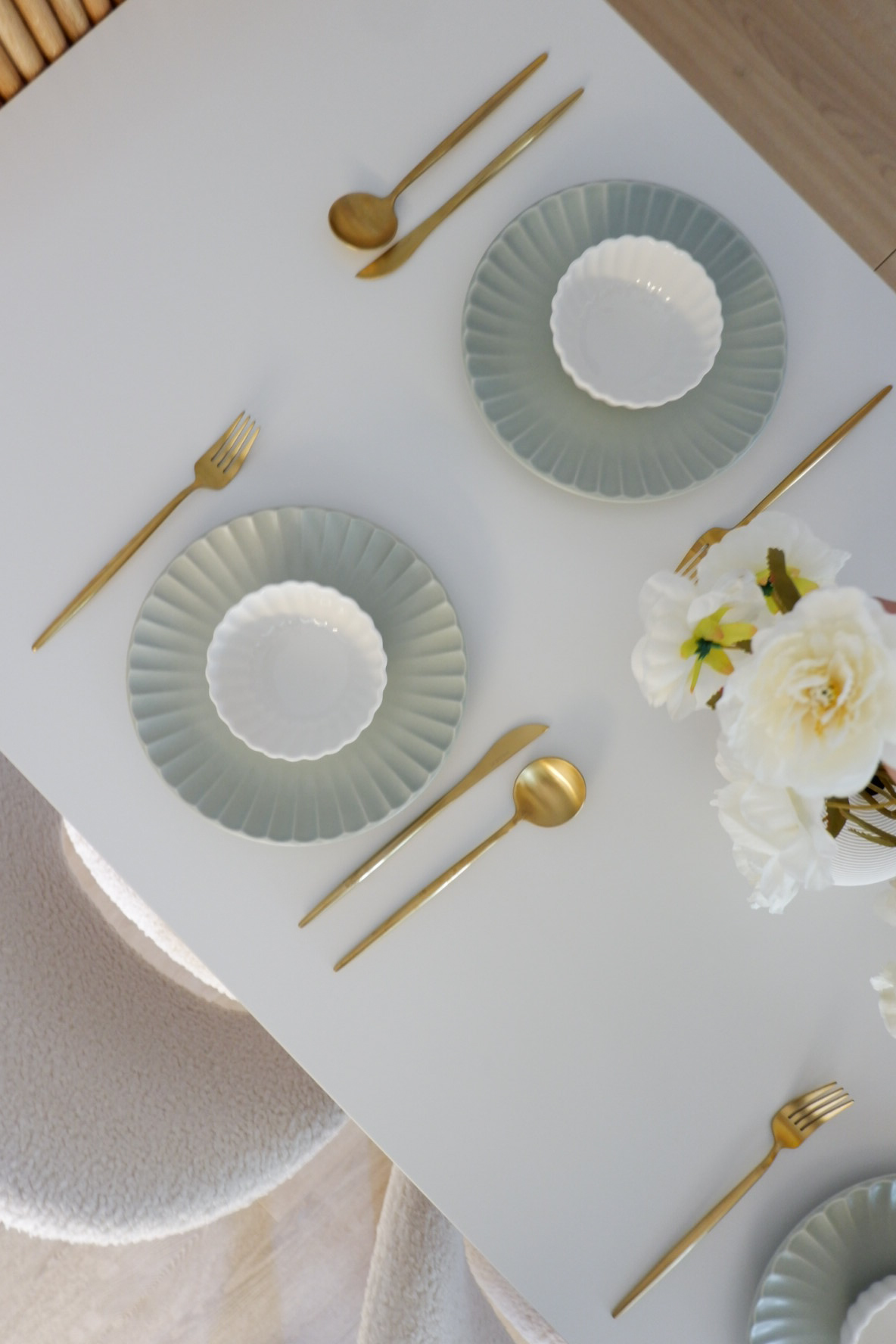 Our Dining Space: Where Lifestyle Meets Functionality - Gold utensils, white plates, elegant table setting, minimalist