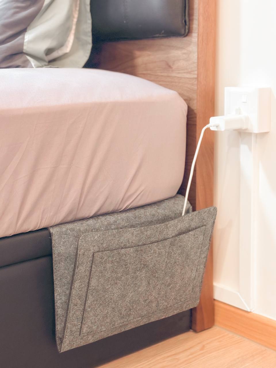 On Bedroom & Marriage Advices  - Grey bed frame, integrated storage, power strip, wall outlet, neatly made bed, soft bedding