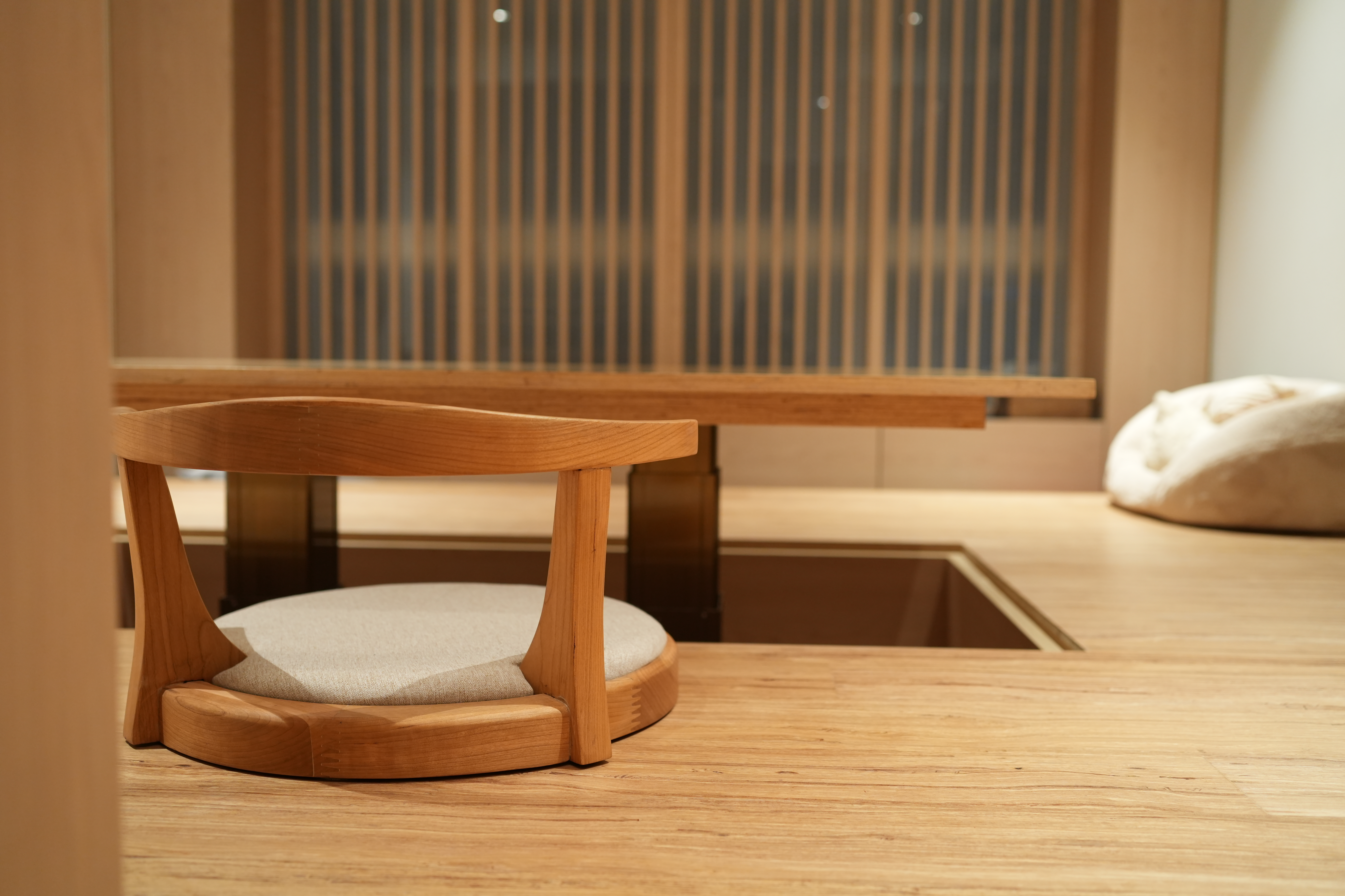 Our Living Room: Multi-Functional, Modern Japanese Versatility - Wooden chair with cushion, minimalist interior, natural wood