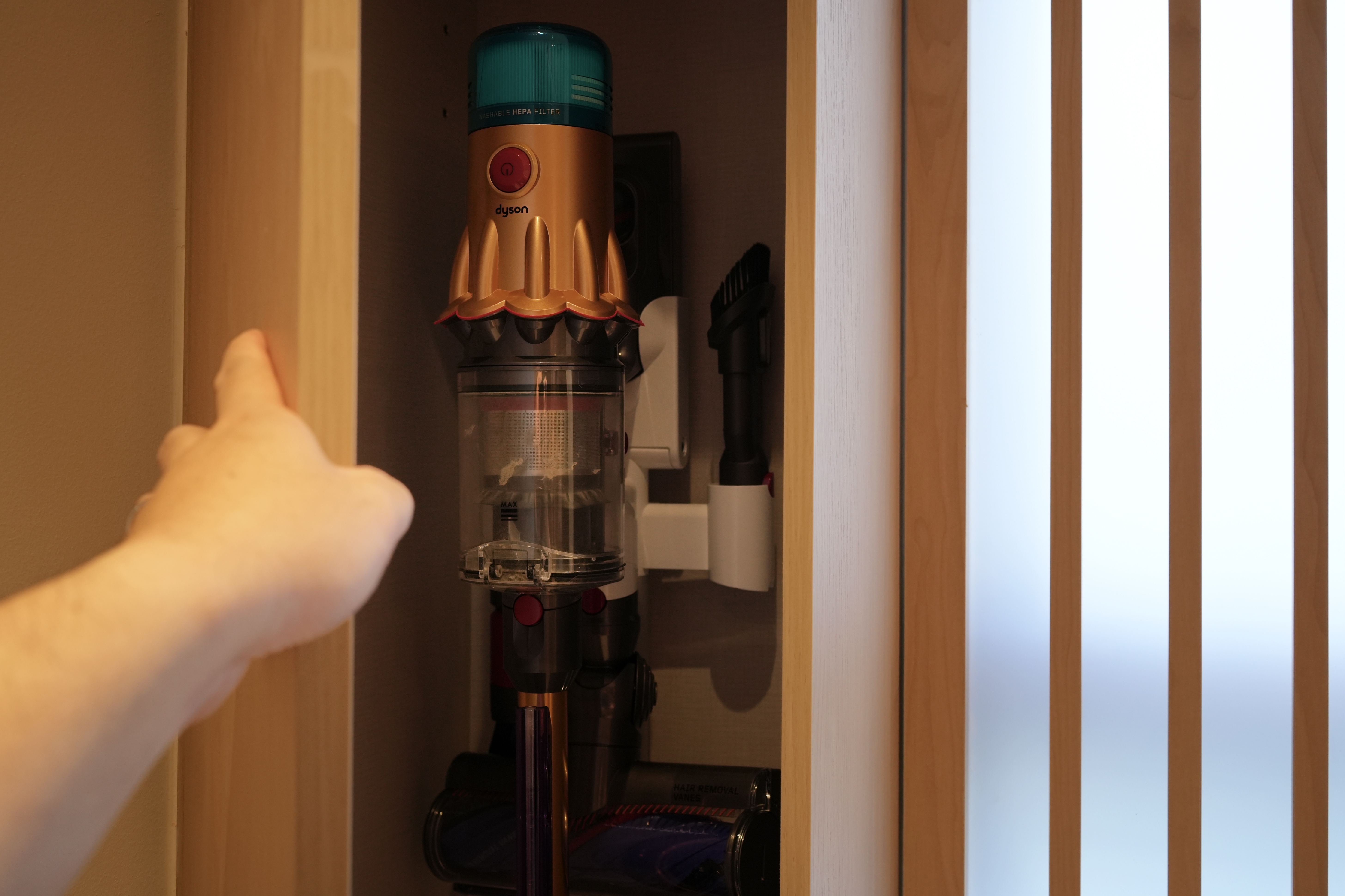 Our Living Room: Multi-Functional, Modern Japanese Versatility - Dyson vacuum cleaner, adjustable HEPA filter, wooden