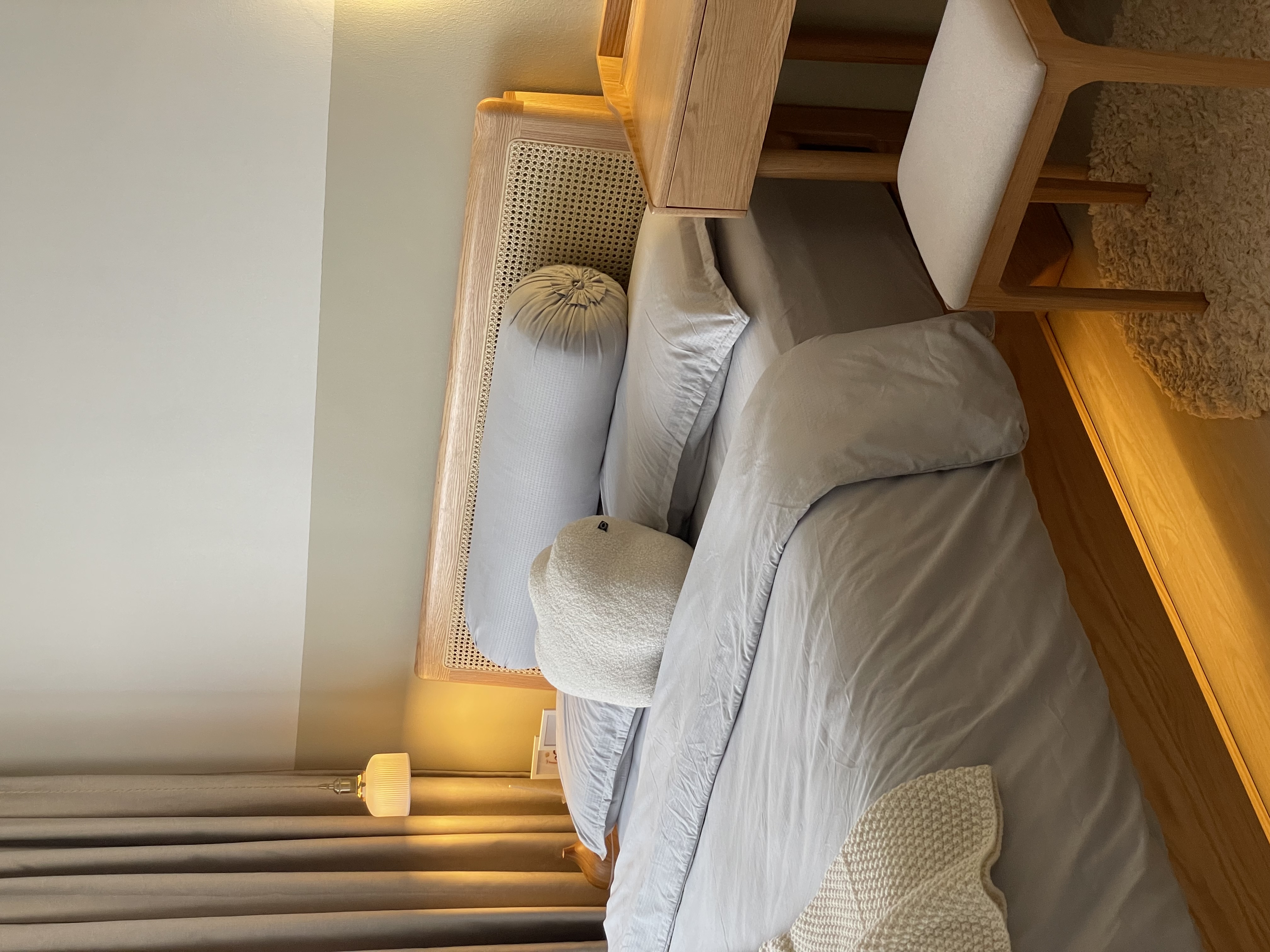 A Glimpse into Our Cozy Master Bedroom Sanctuary 🛏️🌙 - Wooden bed frame, beige bedding, fluffy pillows, soft lighting