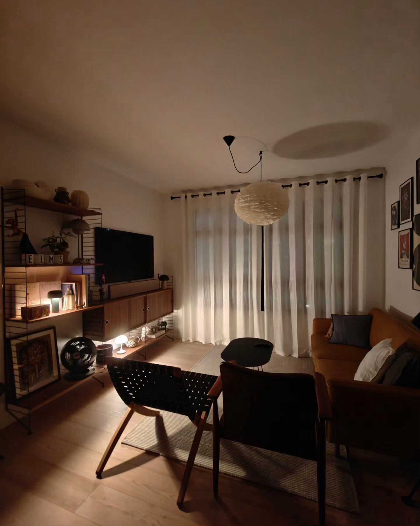 My Hyggelicious Living Room - Modern living room, cozy atmosphere, warm lighting, wooden furniture, black and white decor