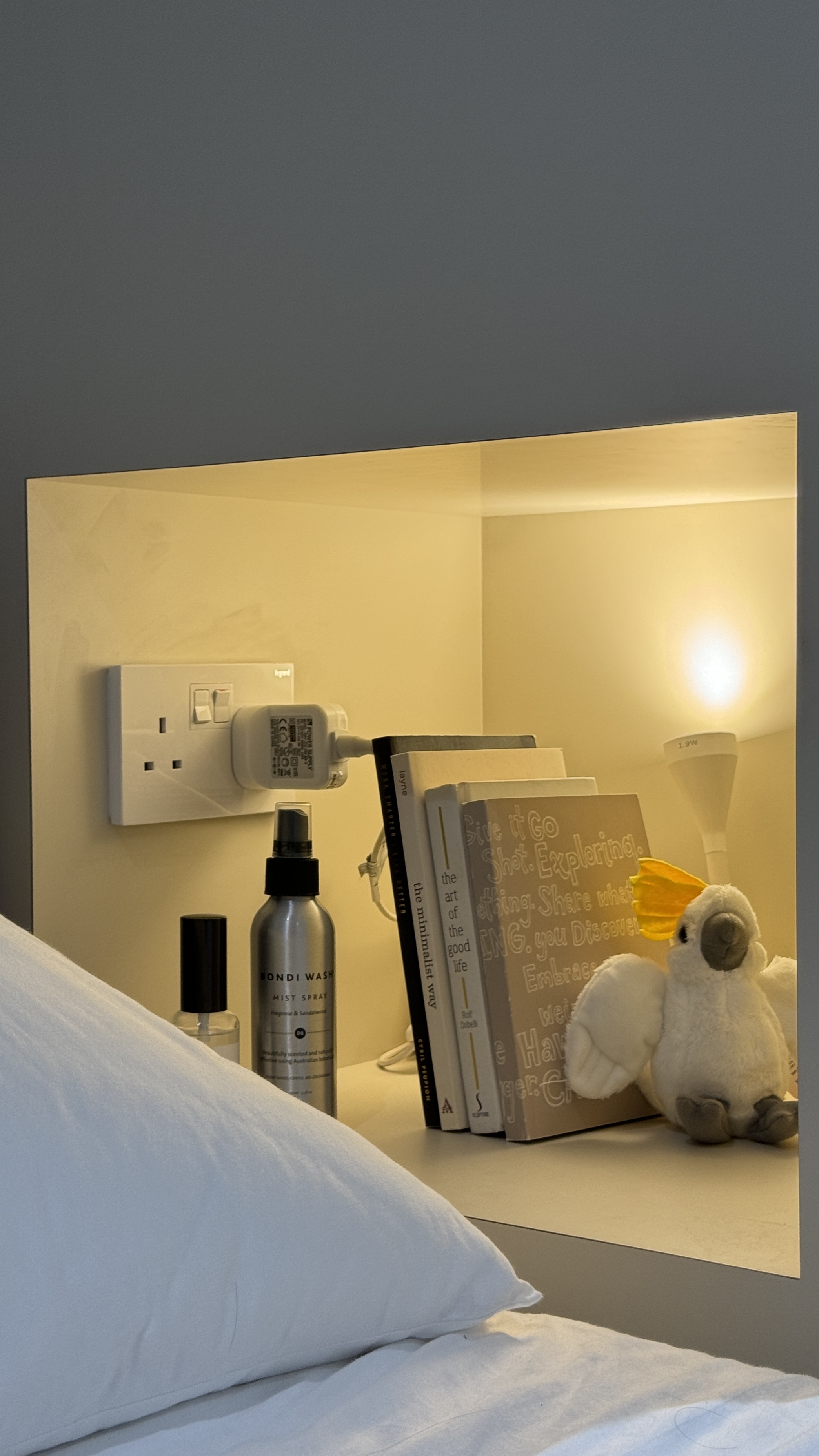 Our Bedroom: A Place Where We Can Check Out the Mood of the Sky - Mirrored room, bedside table, books, lamp, plush toy, white