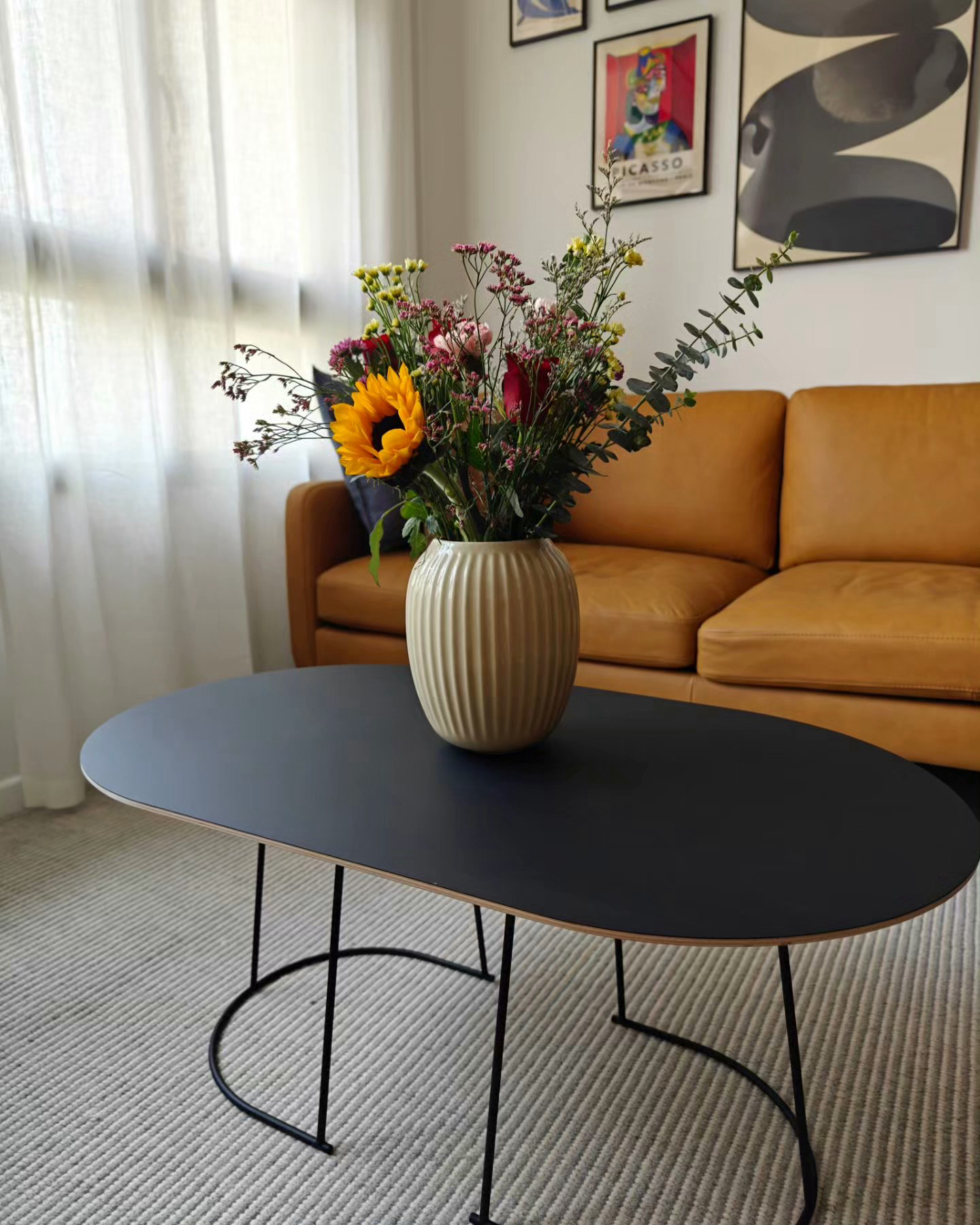 My Hyggelicious Living Room - vibrant bouquet of flowers in beige vase, modern living room decor, abstract art on wall, cozy