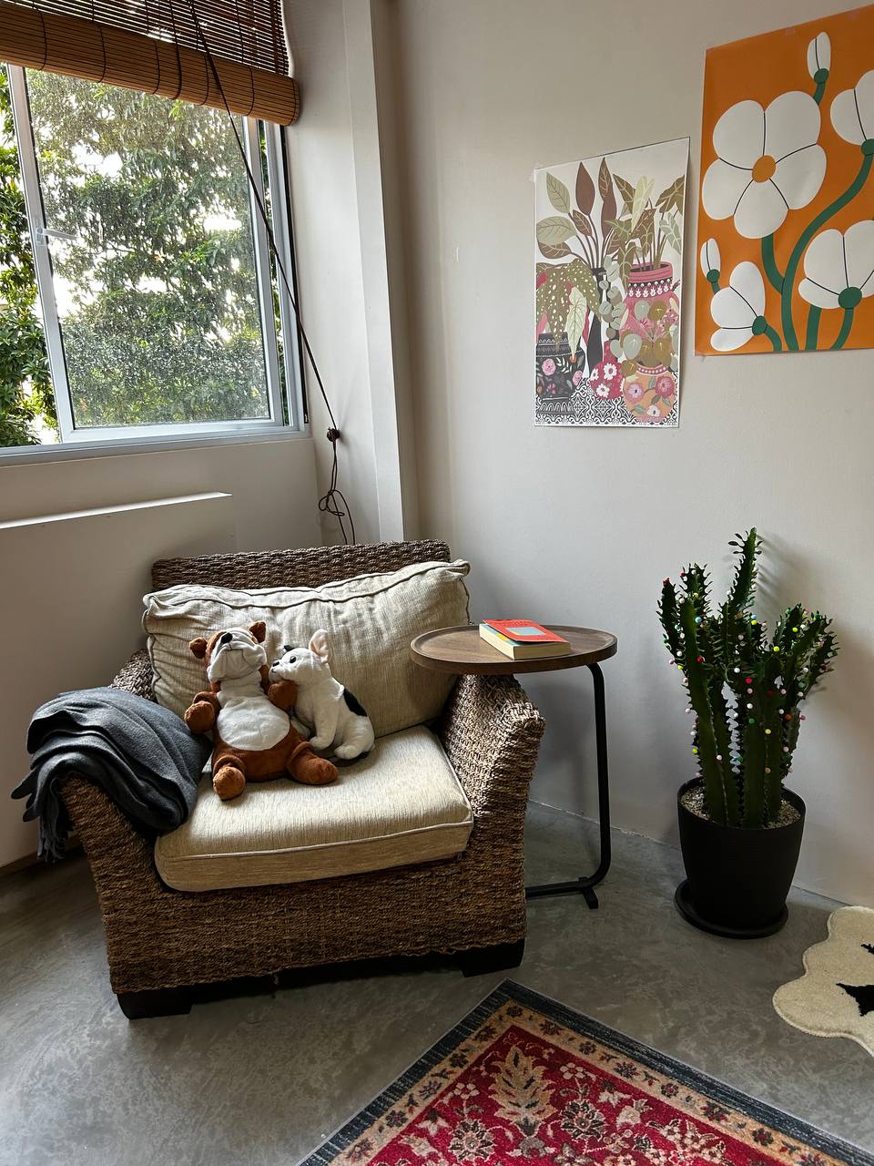 Master Bedroom: Where Nothing Really Mattress - Woven armchair, plush teddy bears, indoor plants, colorful abstract art, cozy