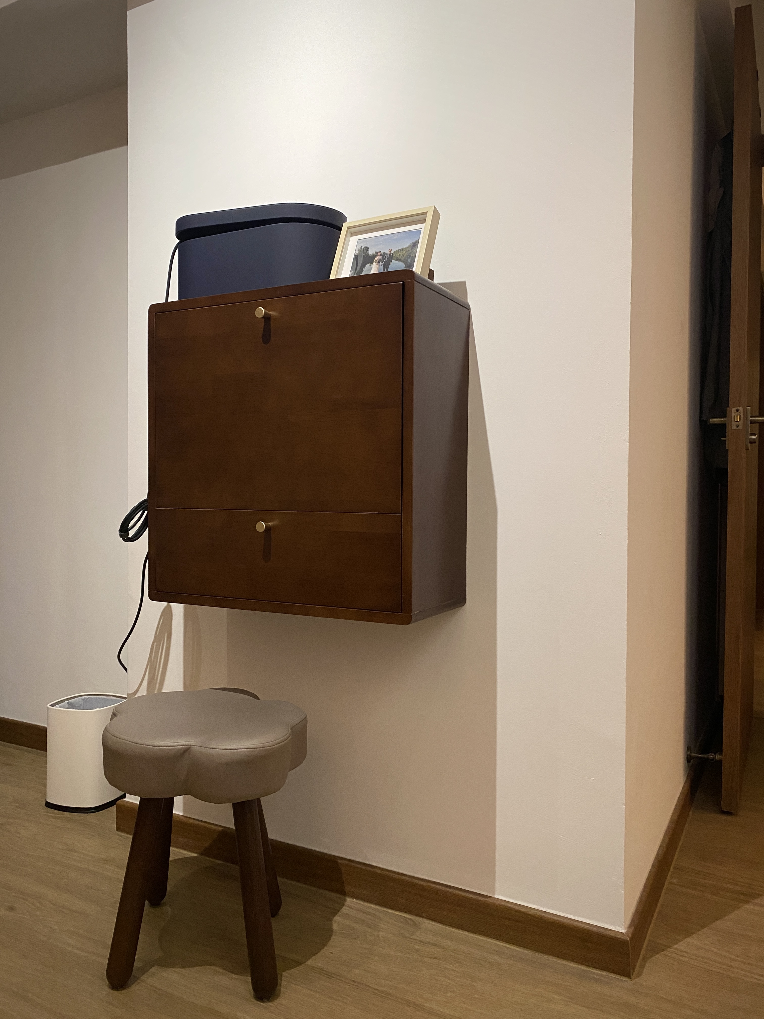 Our Restful Haven: Comfy Bed, Blackout Curtains and Ambient Light - Wooden cabinet, brown finish, wall-mounted, storage unit