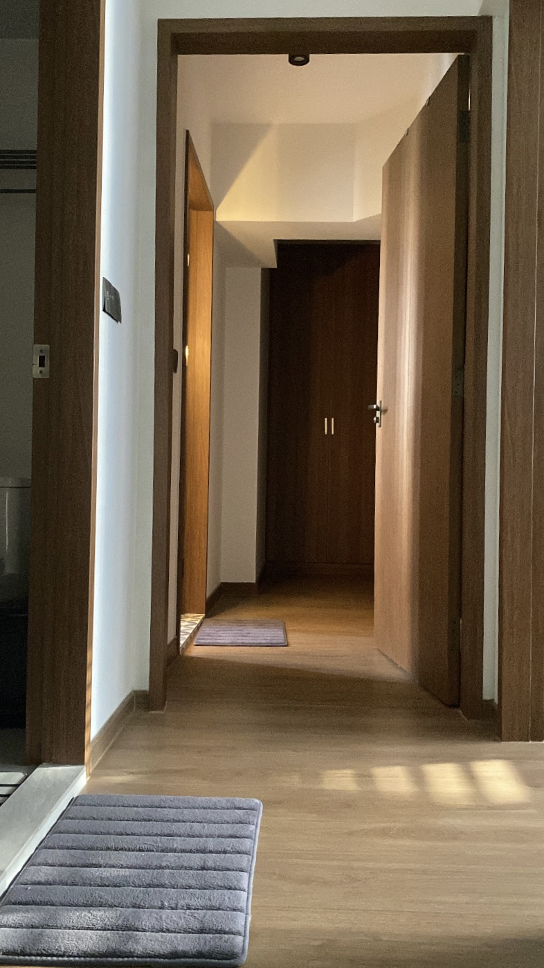 Our Restful Haven: Comfy Bed, Blackout Curtains and Ambient Light - Wooden hallway, open doors, wooden paneling, light