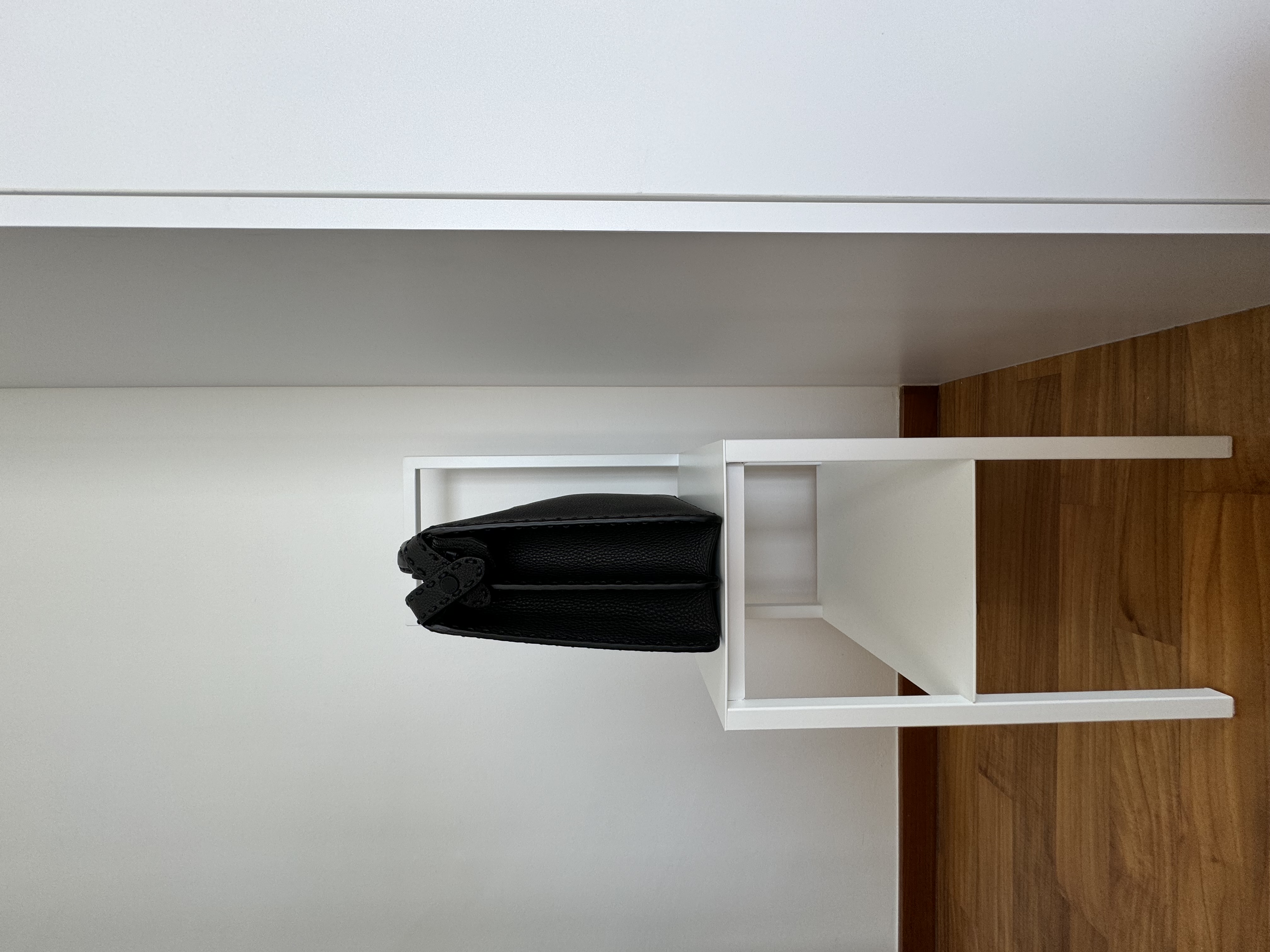 La-La Land @ Rumah Beacon - White minimalist shelving unit, black textured garment, modern interior design, sleek white
